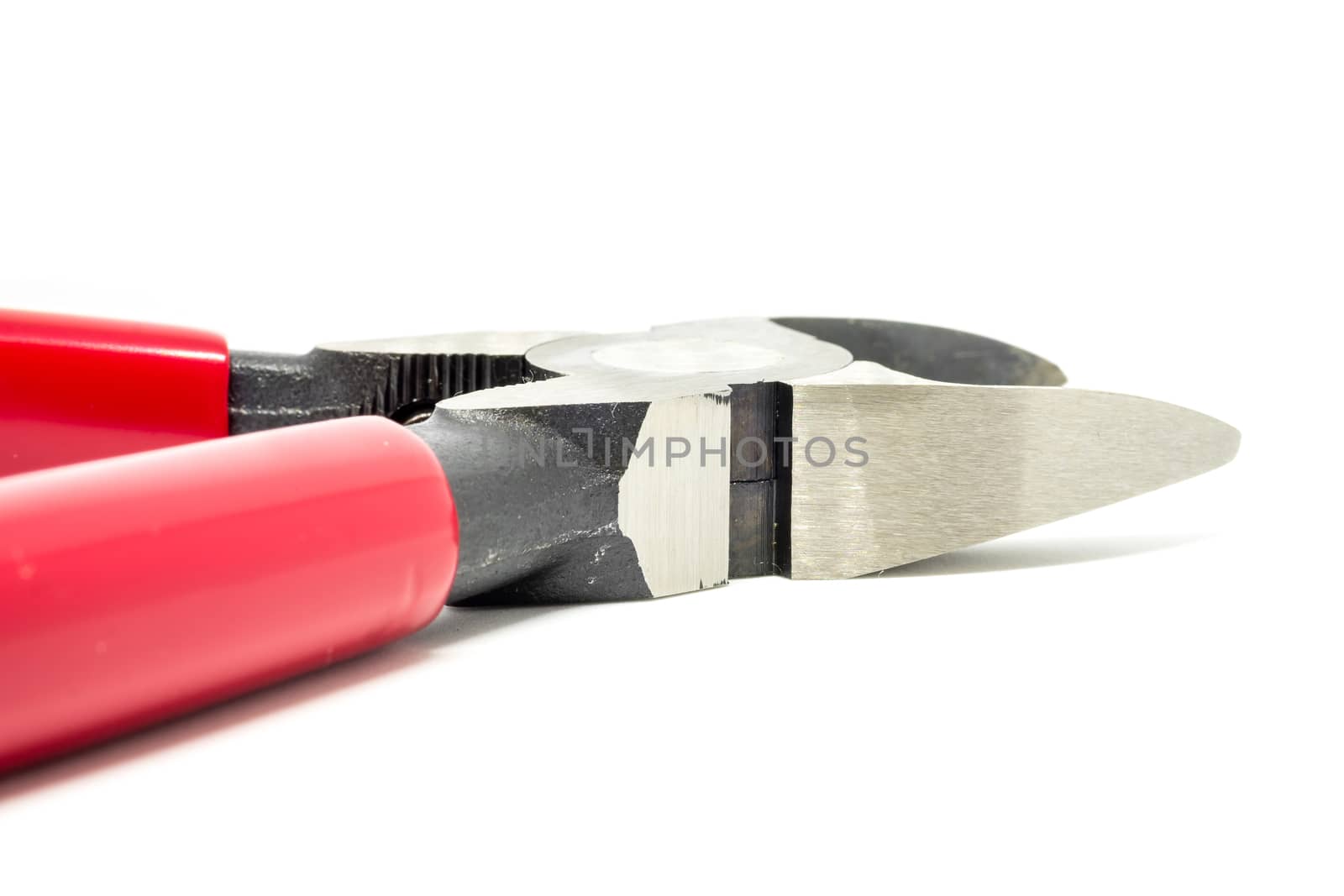 Red open and handled pliers  on a white background.Tools series.