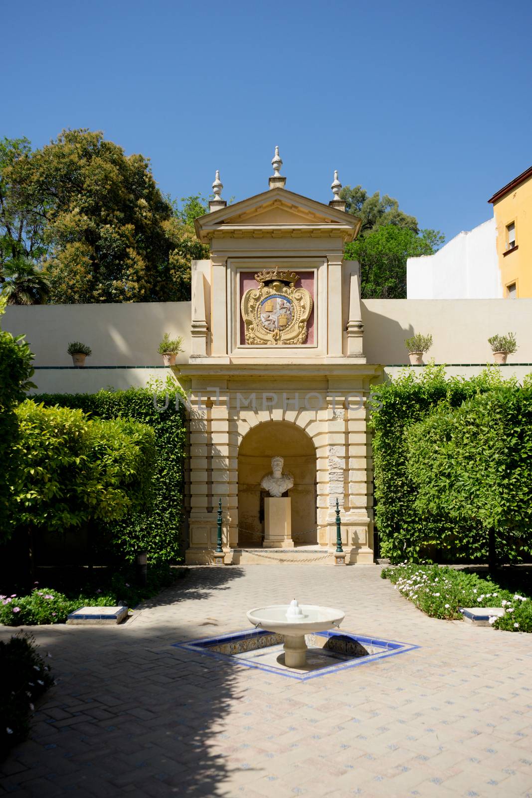 Seville, Spain - June 19: Water fountain in the Alcazar garden, Seville, Spain on June 19, 2017.