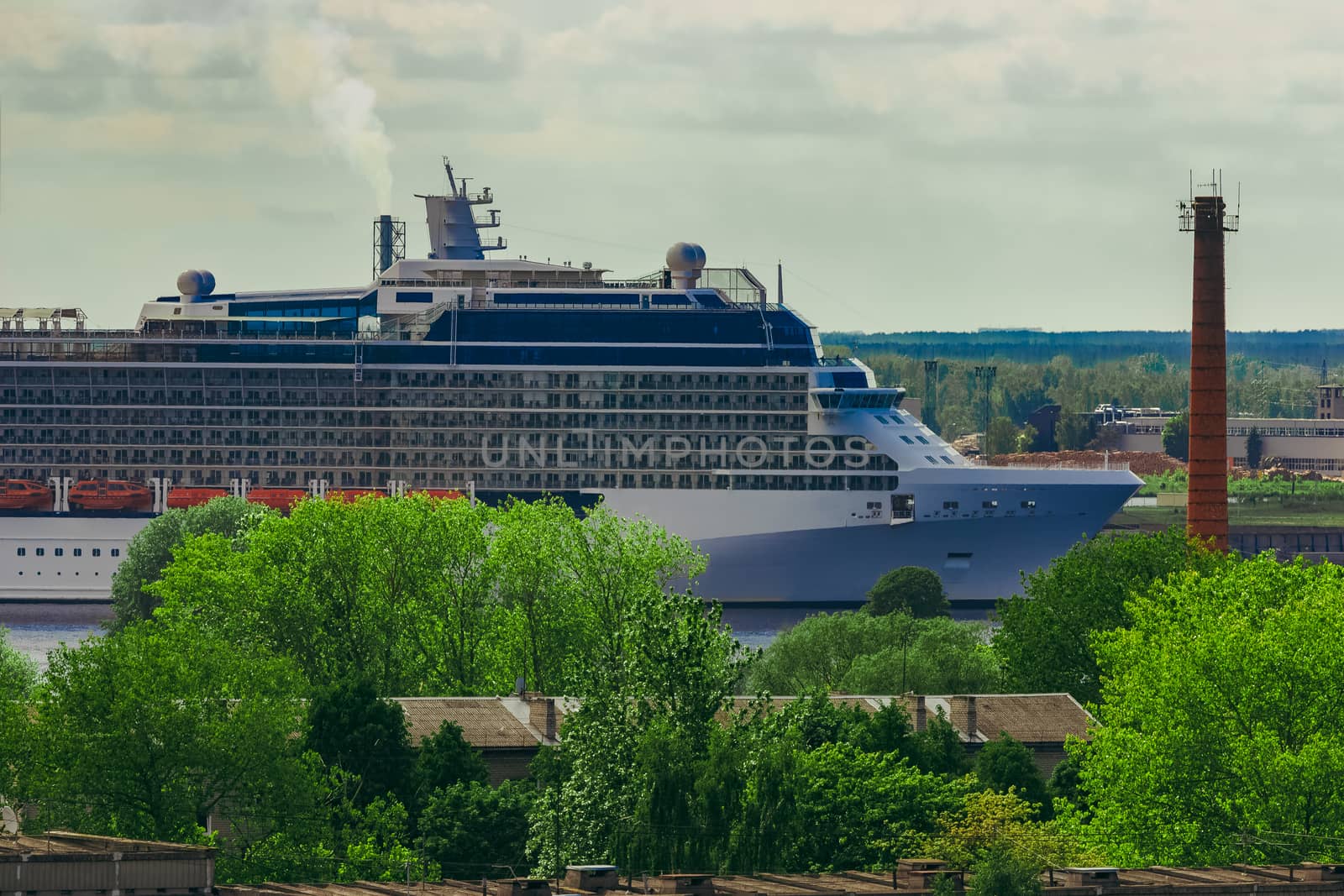 Large cruize liner. Passenger ship moored in old town