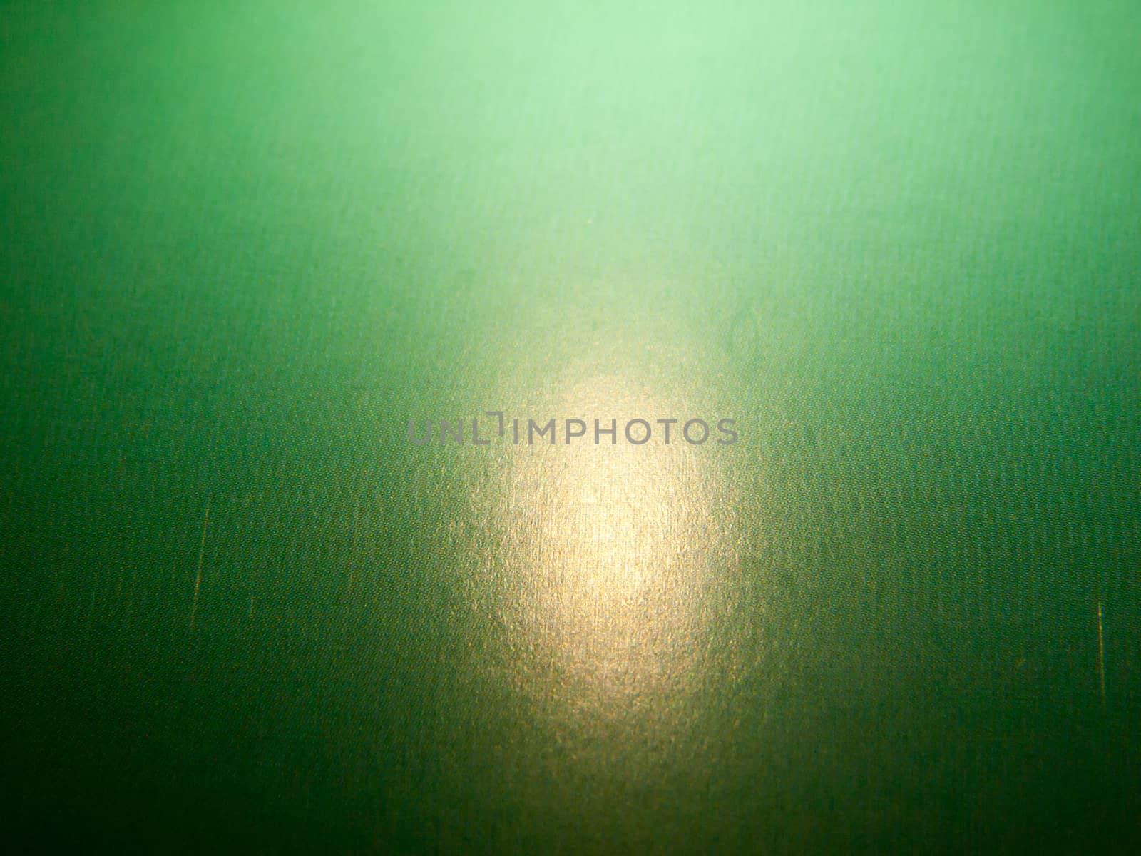 a retro green textured surface with light orb; England; UK