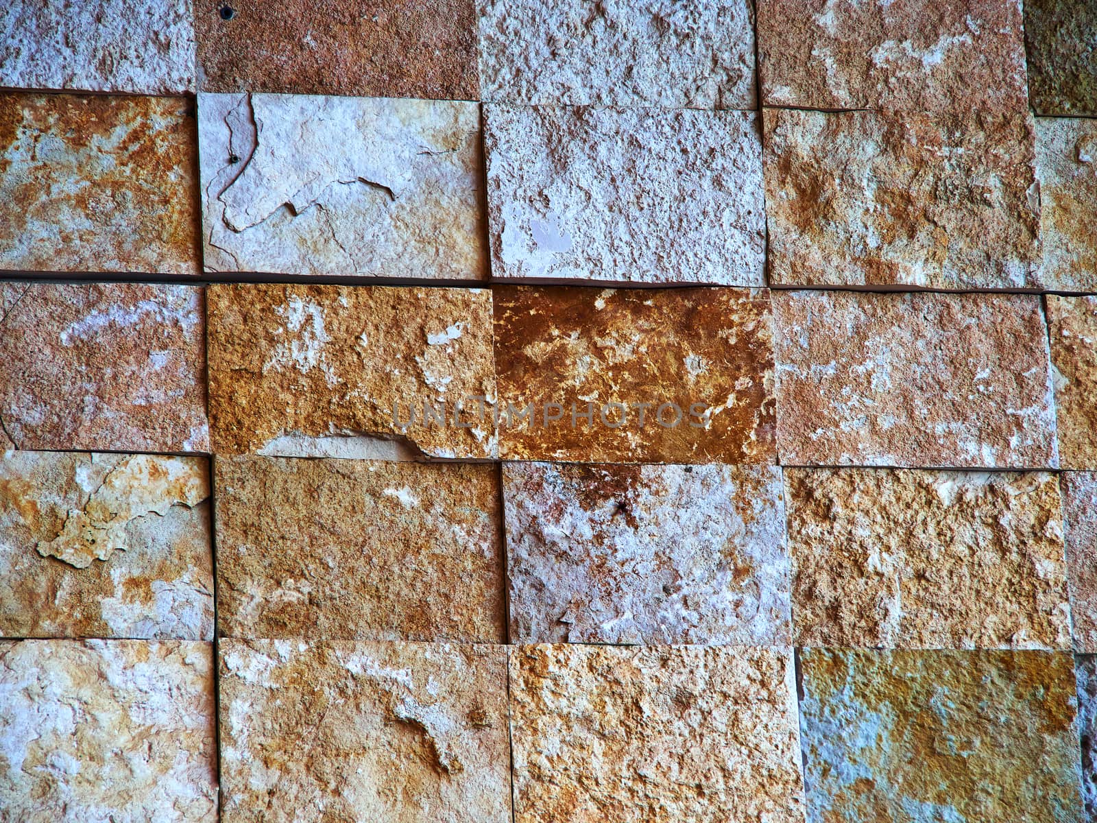 Details of decorative stone wall in light earth colors