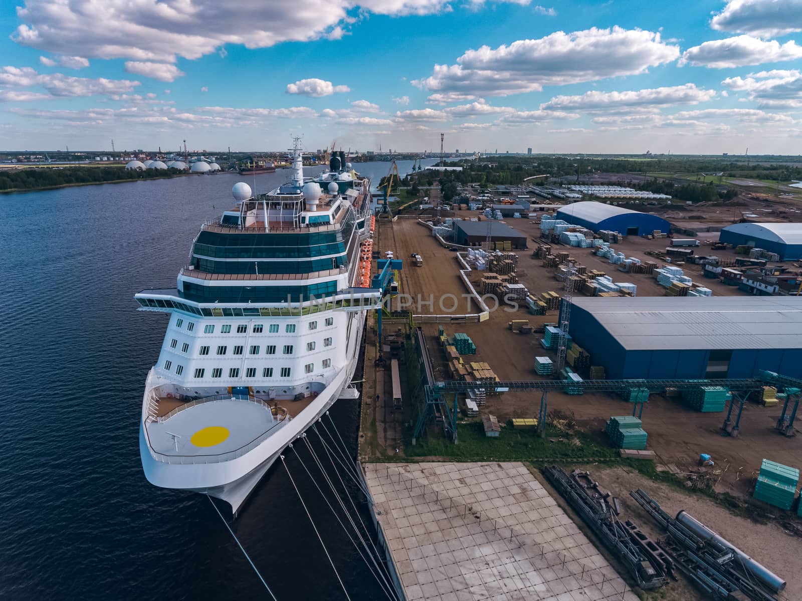 Big white passenger ship moored at the cargo port