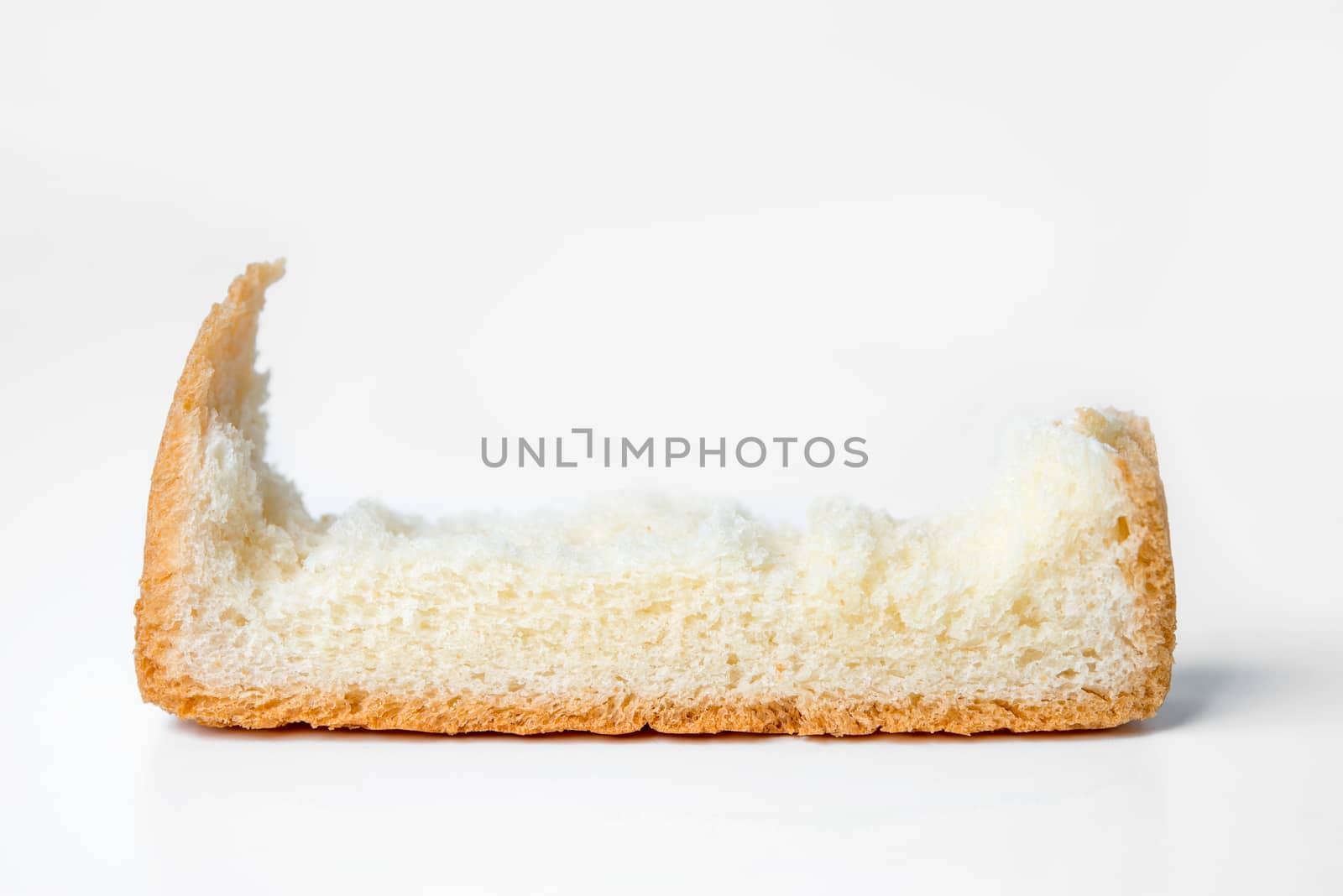 bread torn on white background by antpkr