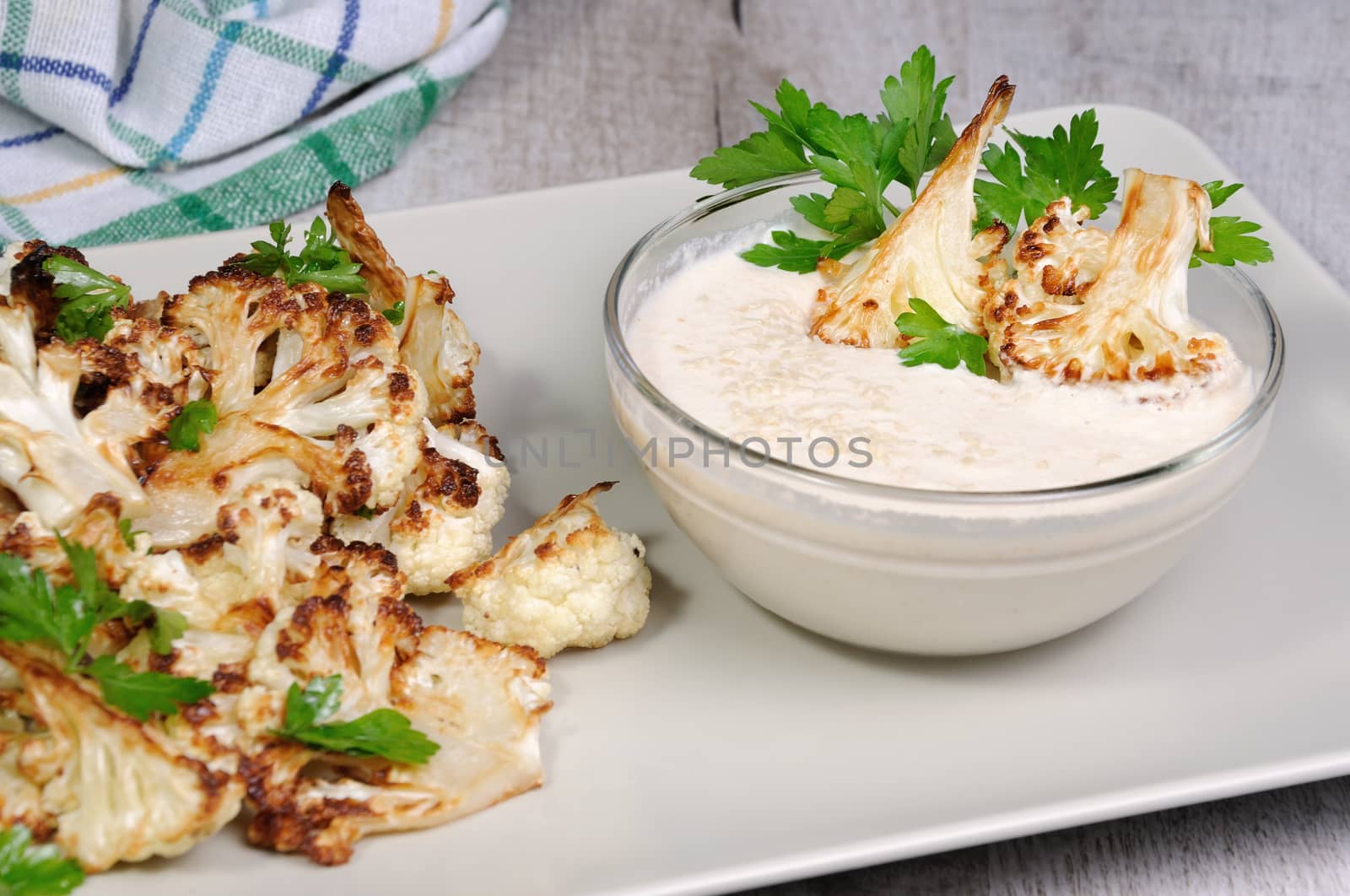 Roasted cauliflower with tahini sauce (sesame paste)