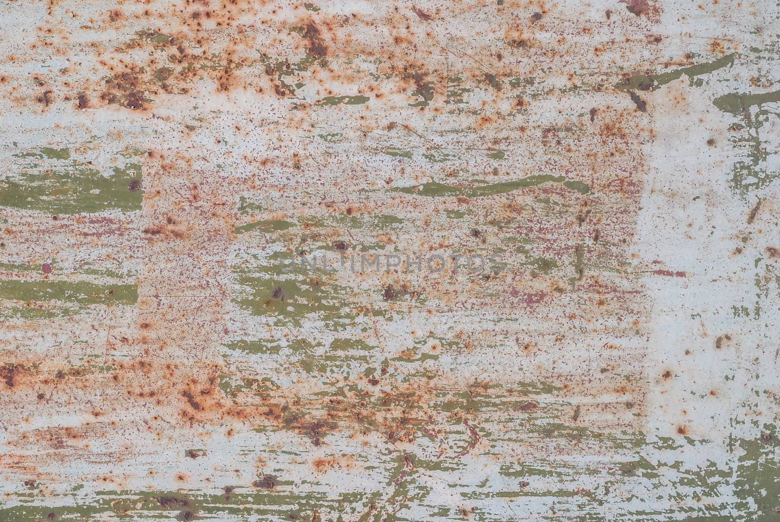 fragment of an iron surface is covered with color paint, which has long been under the influence of different climatic conditions