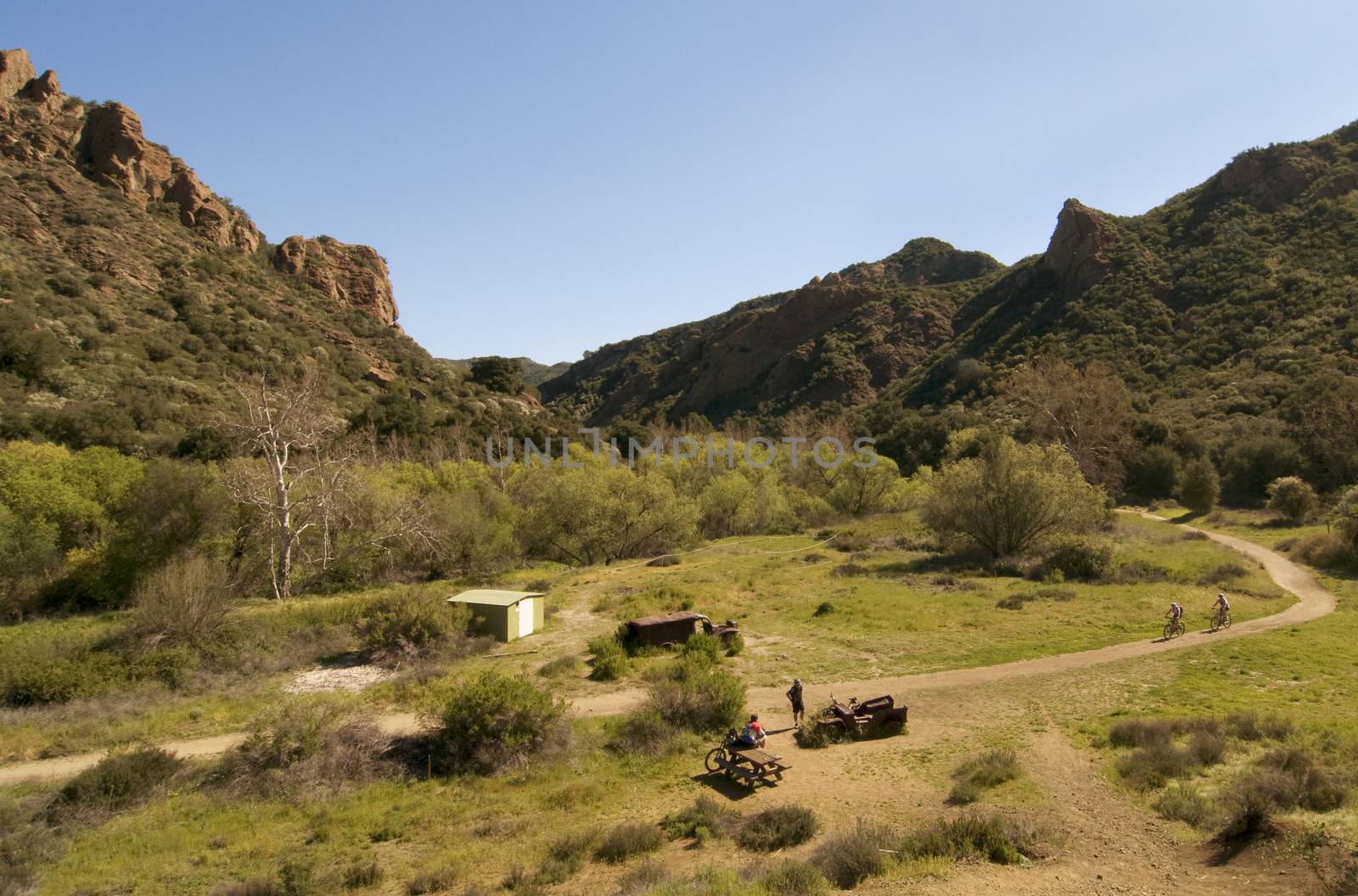 Bicyclists at M.A.S.H. Site from Crags Road, Malibu Creek State  by Njean