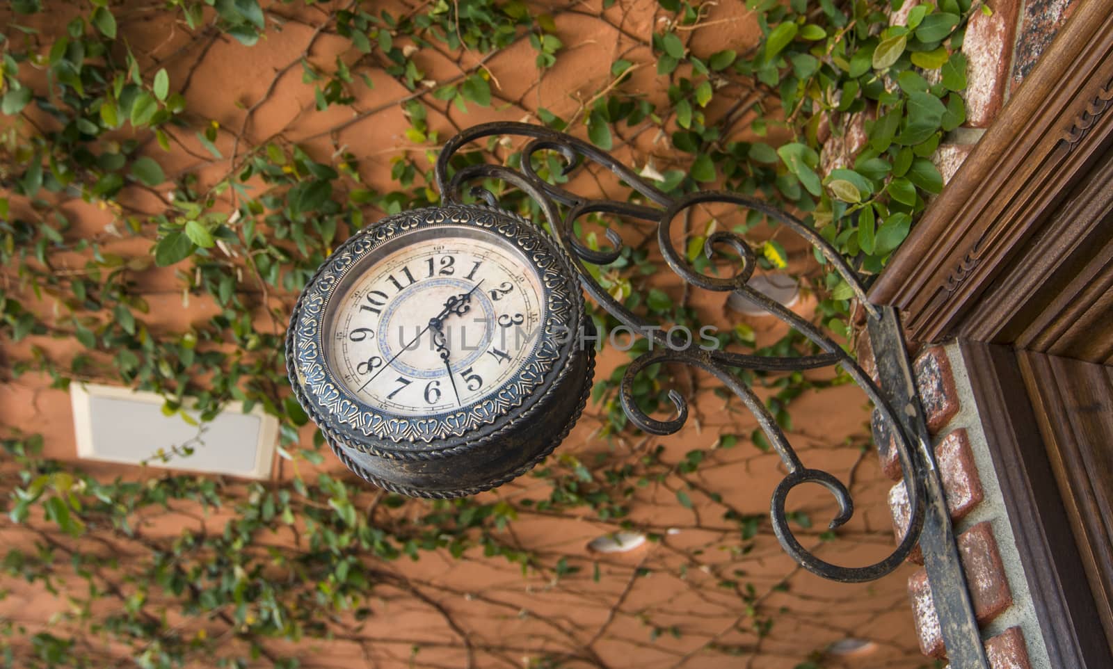 Hanging antique clock by Njean