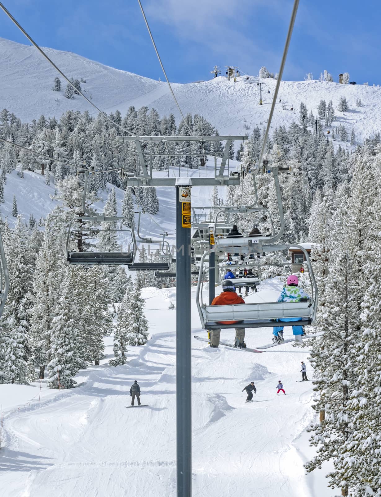 Winter ski lift riders