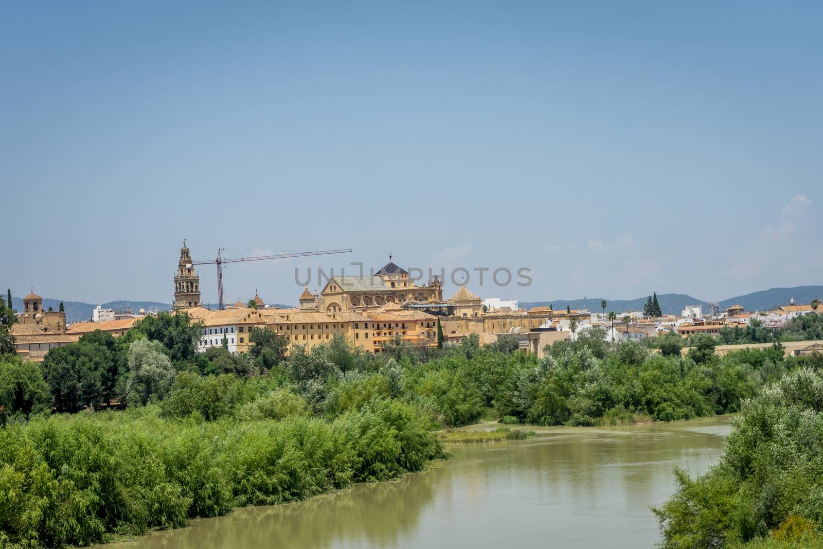 The bell tower and Cathedral mosque of Cordoba from the bridge o by ramana16