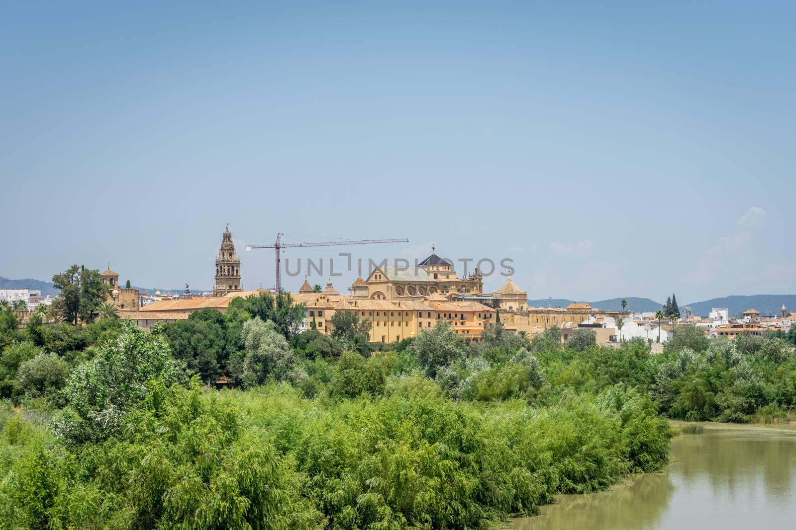 The bell tower and Mezquita de Córdoba,the Great Mosque of Córdoba, Mosque-Cathedral,Mezquita from the bridge on river Guadalquivir