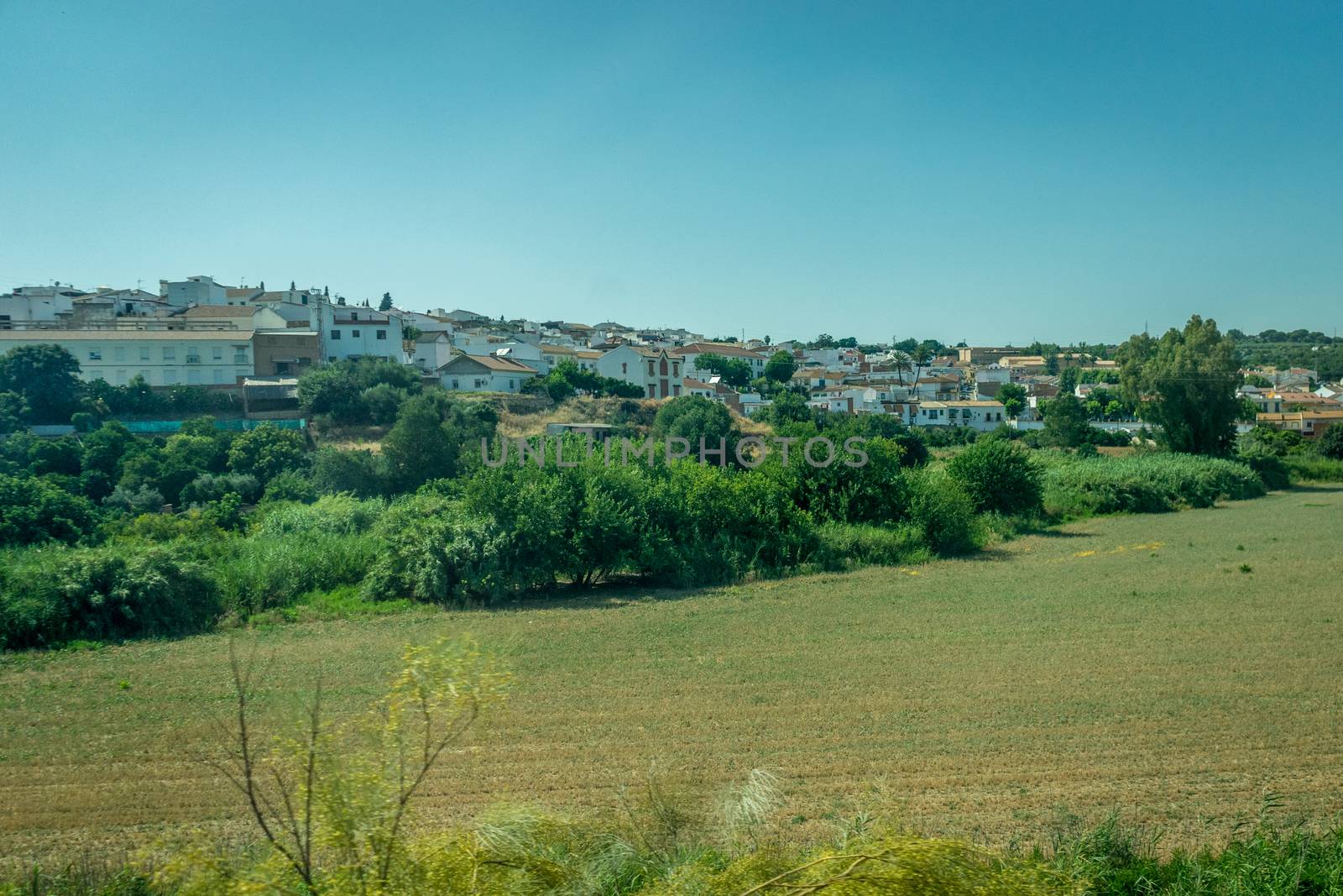 White houses in the spanish countryside of Cordoba, Spain, Europe on a bright sunny day with blue sky