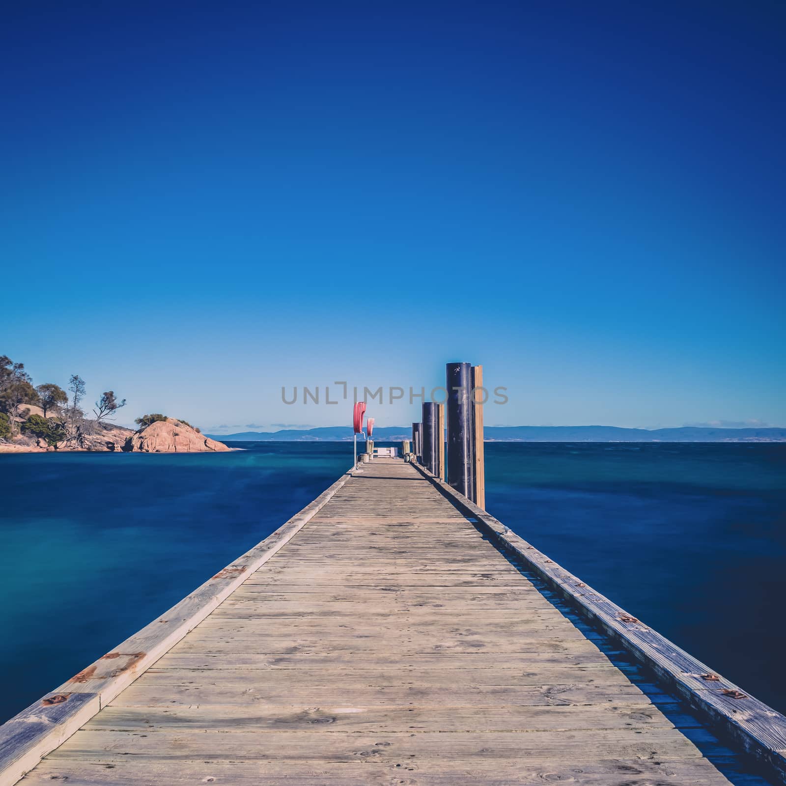 Freycinet Pier by Coles Bay in Tasmania by artistrobd