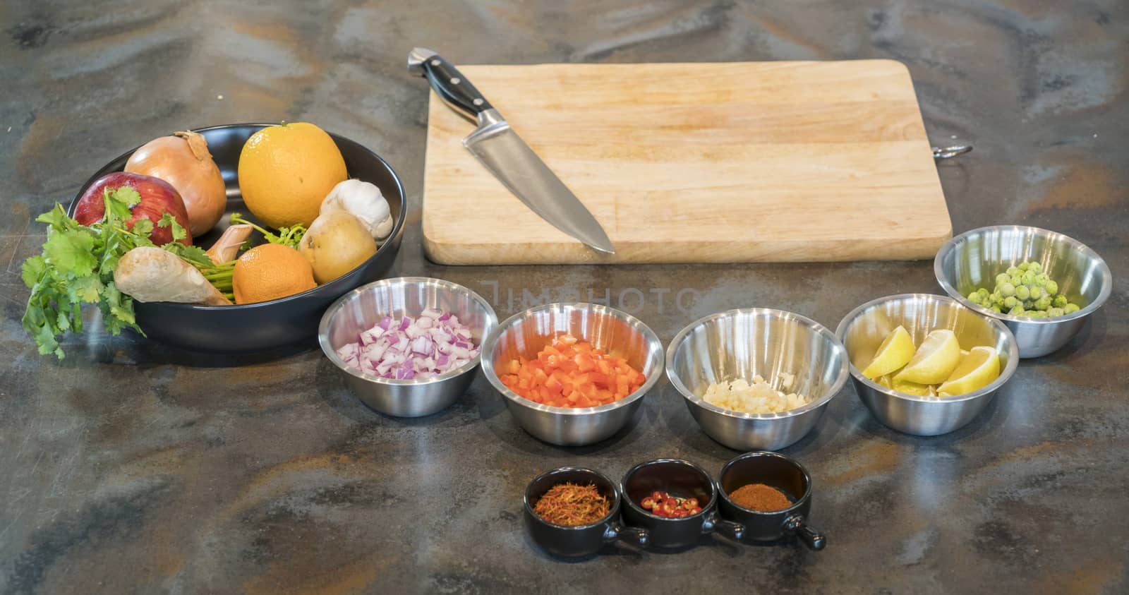 Different food ingredient with knife on cutting board, ready to prepare food