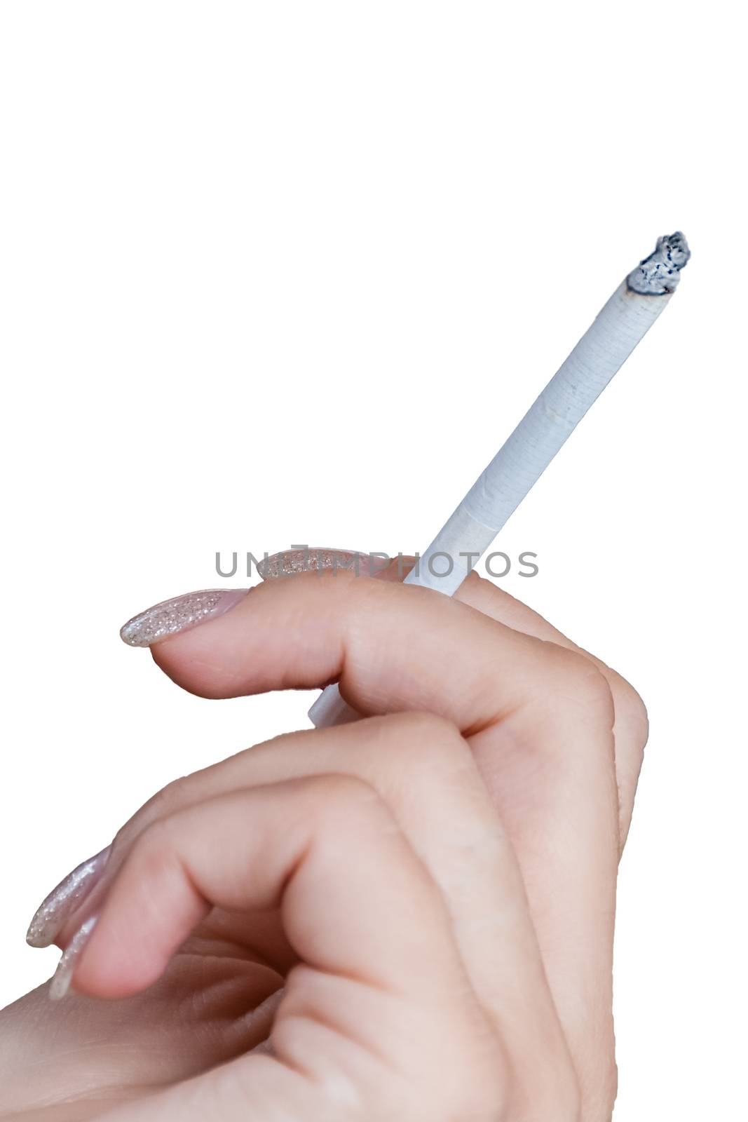 Female Hand holding a cigarette isolated on white background, fingernails nicely manicured, cigarette is lit