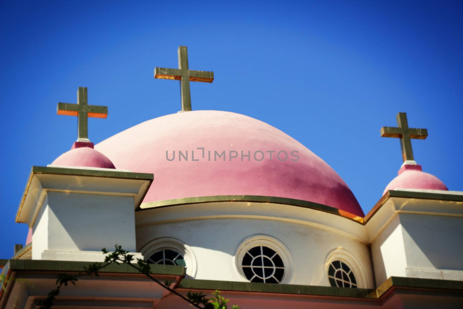 Holy Church - Roof of a church with a crucifix sculptures.