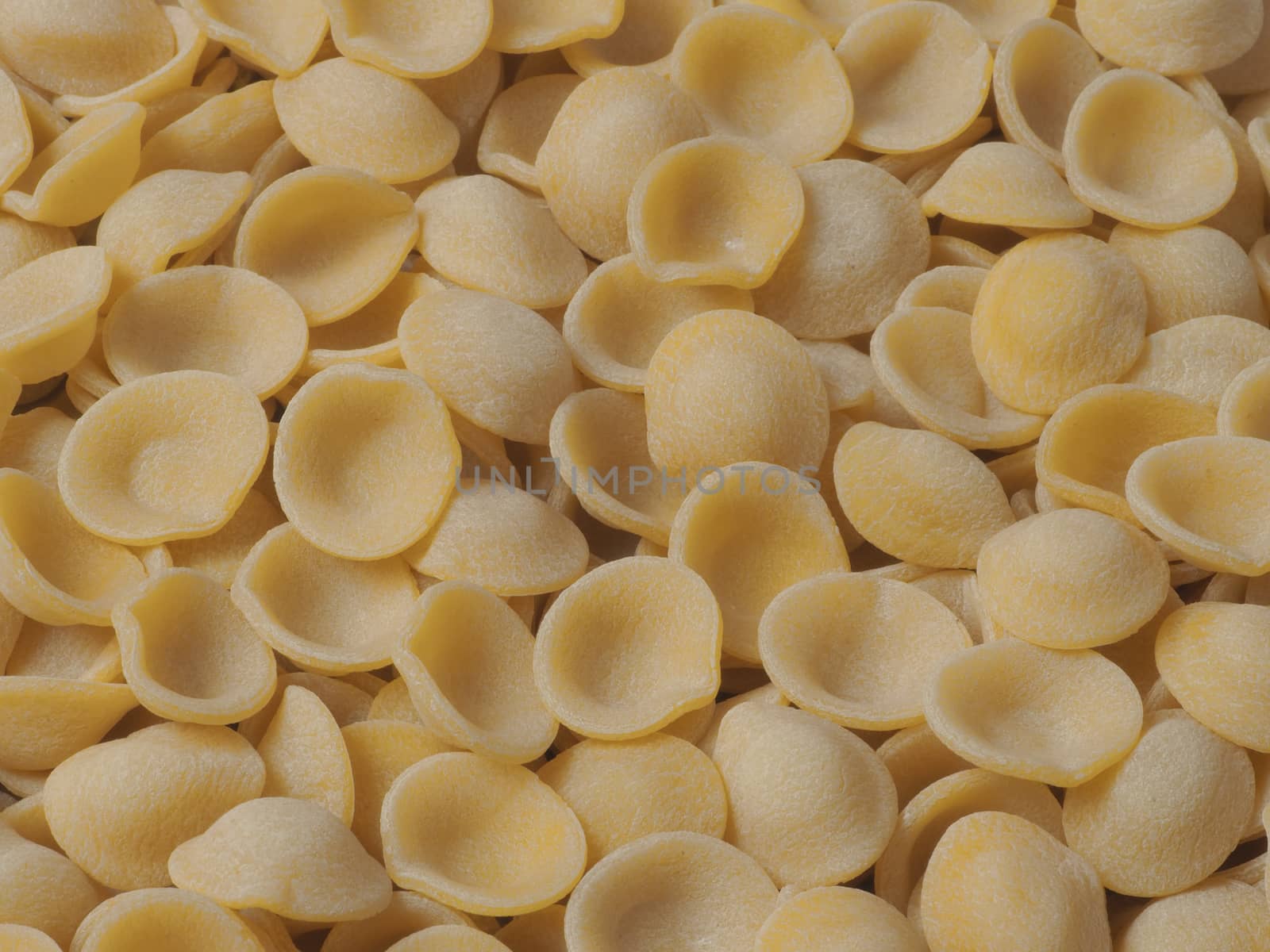 close up of dried italian orecchiette pasta food background