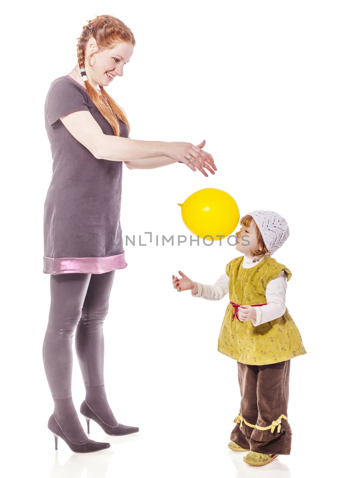 Mother playing with two years daughter isolated on white