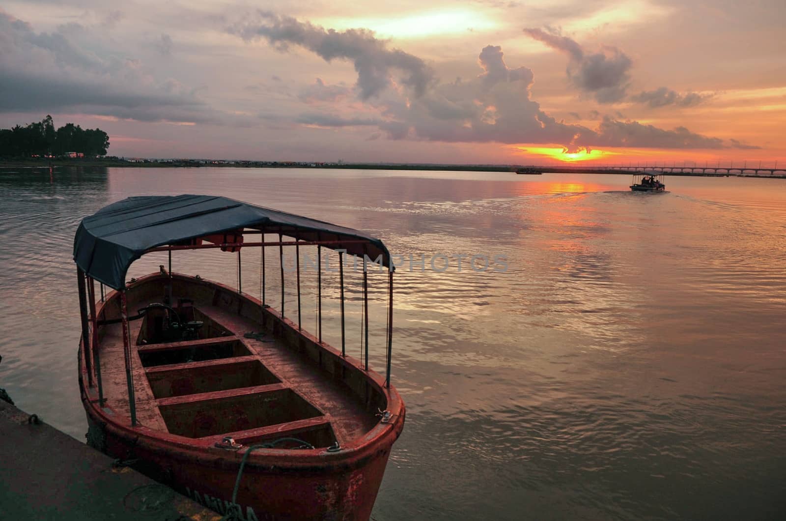 Morning light over the river and boats