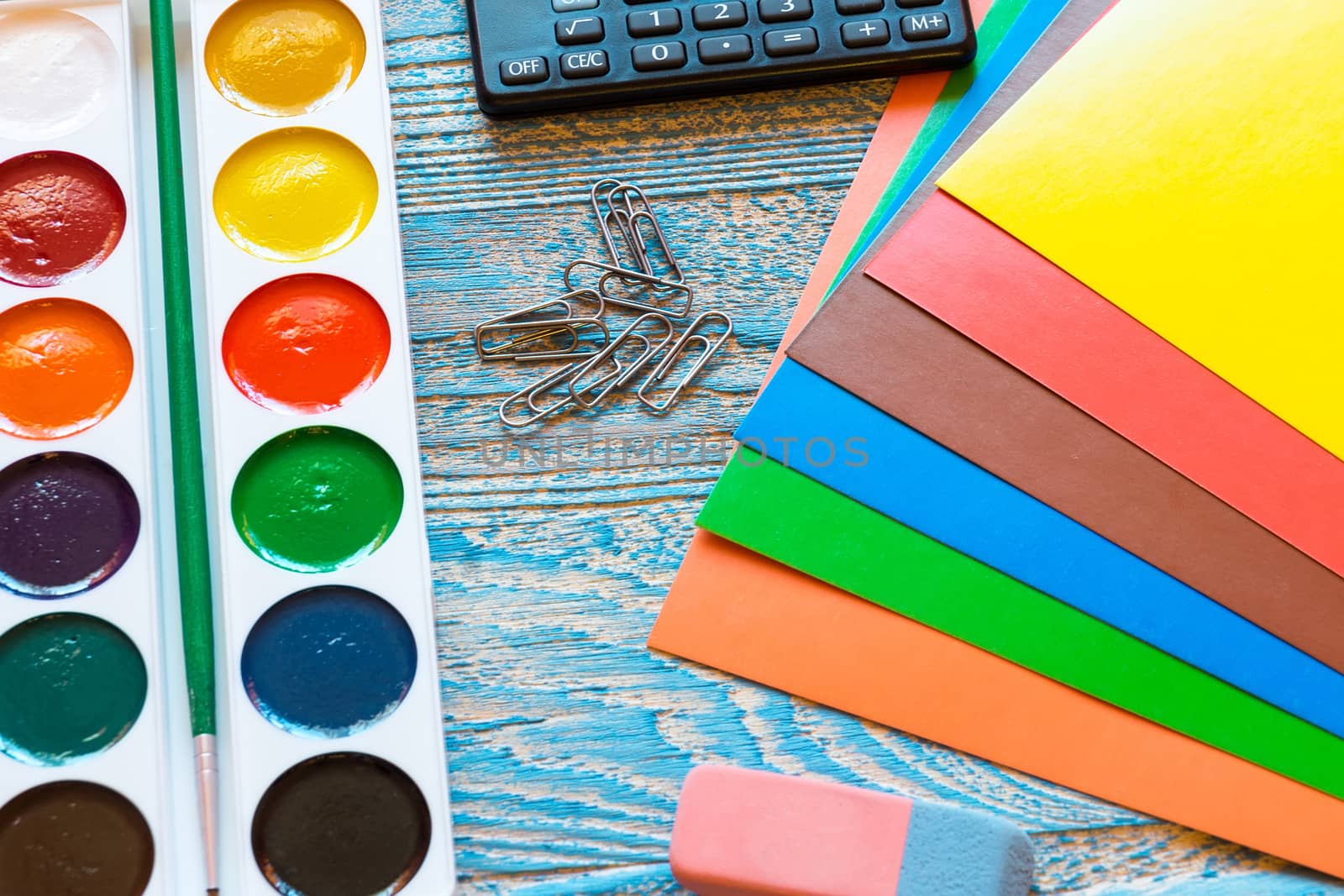 School supplies on a blue background by AlexBush