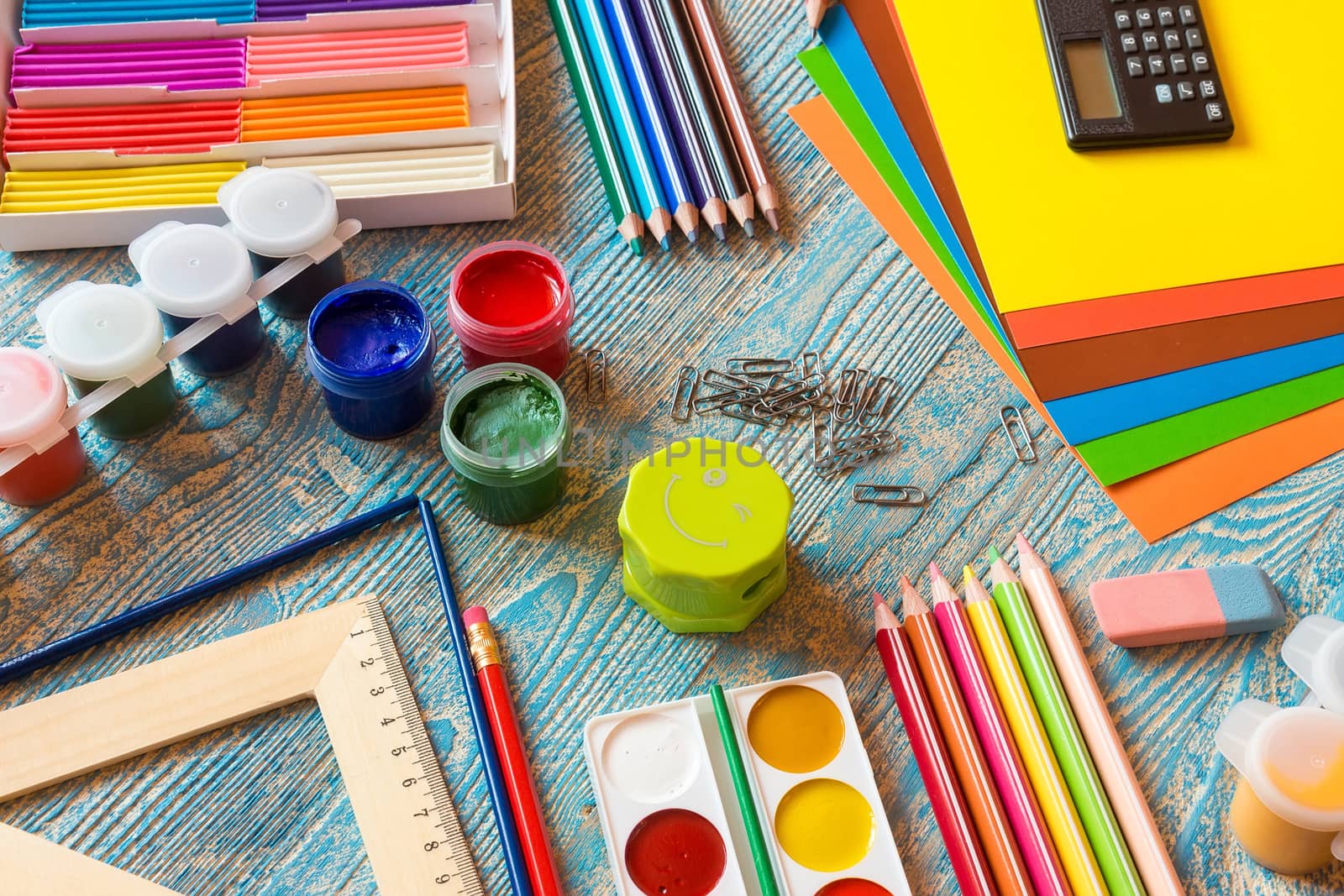 School supplies on a blue background by AlexBush