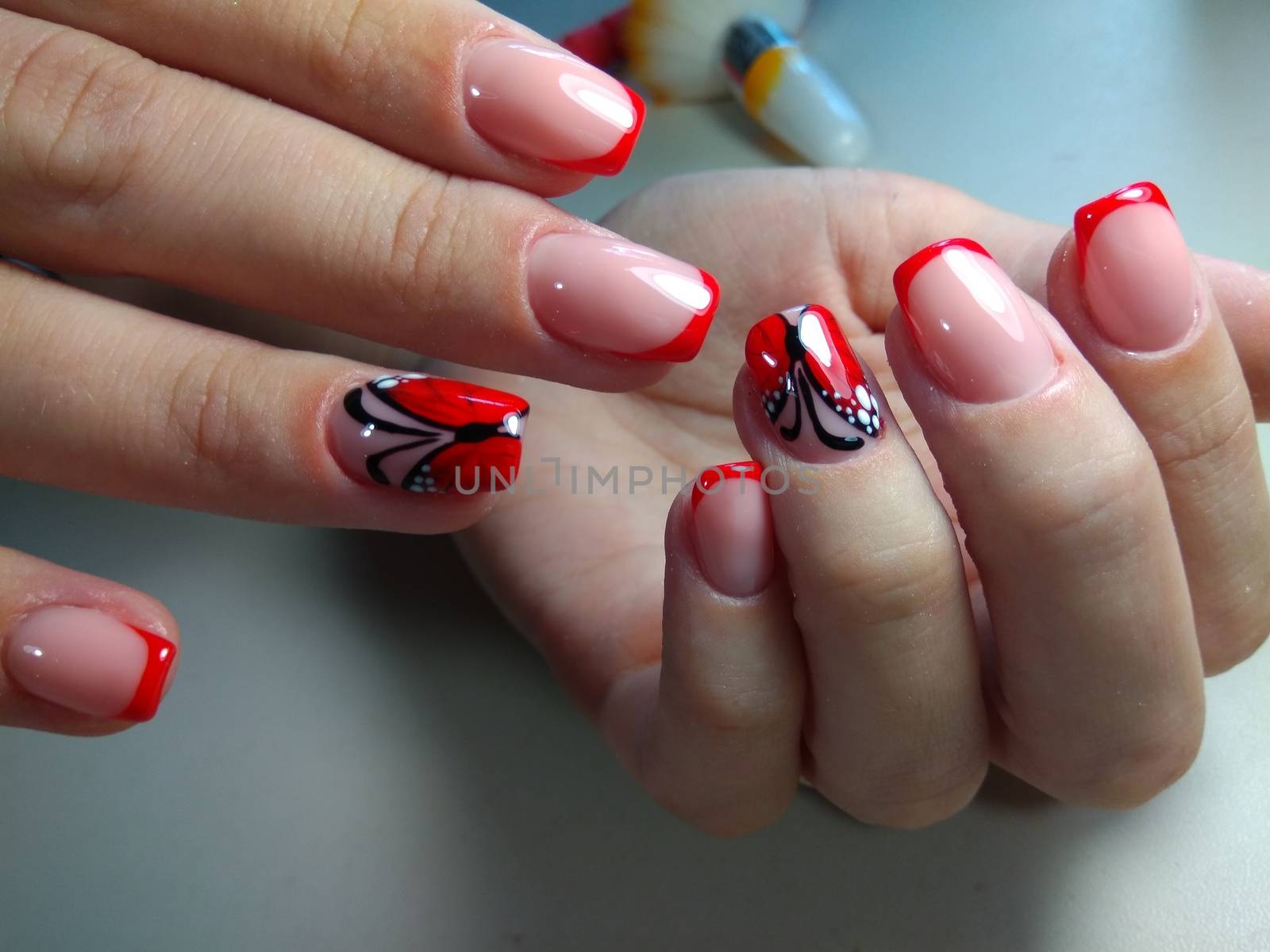 Here is presented one of the best manicure designs this year's Nail red butterfly