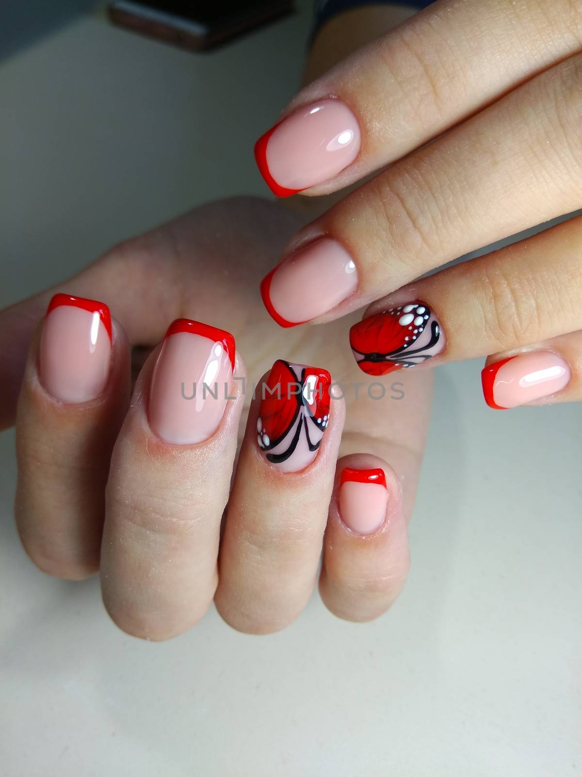 Beautiful manicure red butterfly by SmirMaxStock