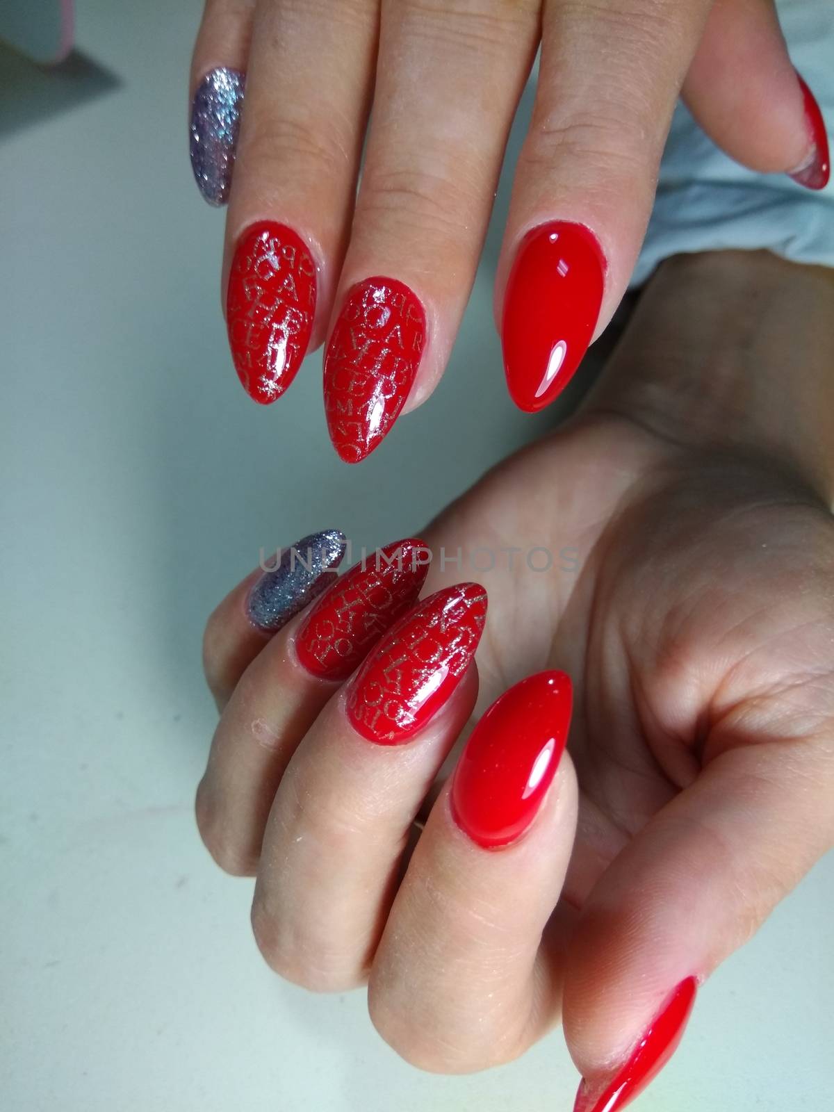 Red manicure design by SmirMaxStock