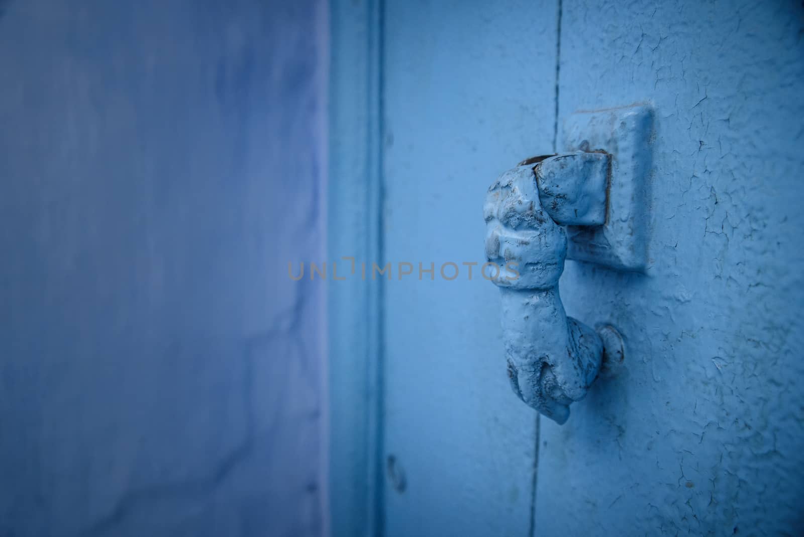 Knocker in Chefchaouen, the blue city in the Morocco. by johnnychaos