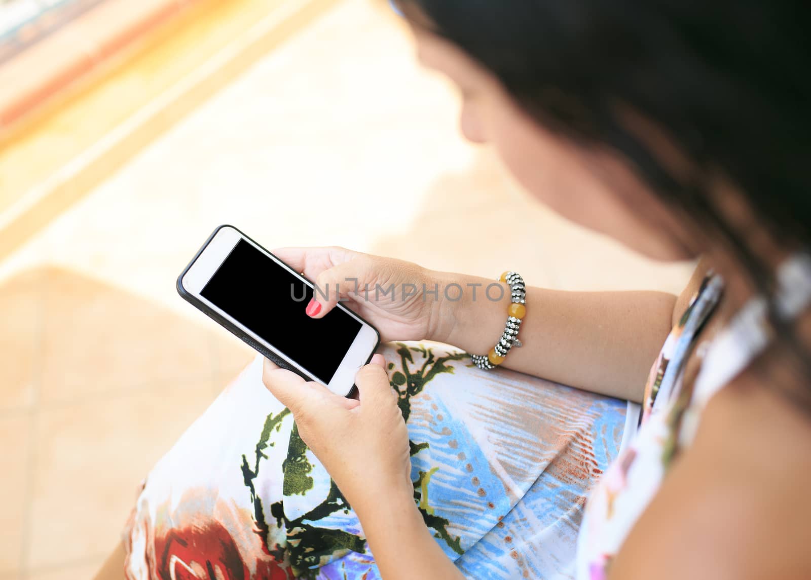 woman looking her smart  phone