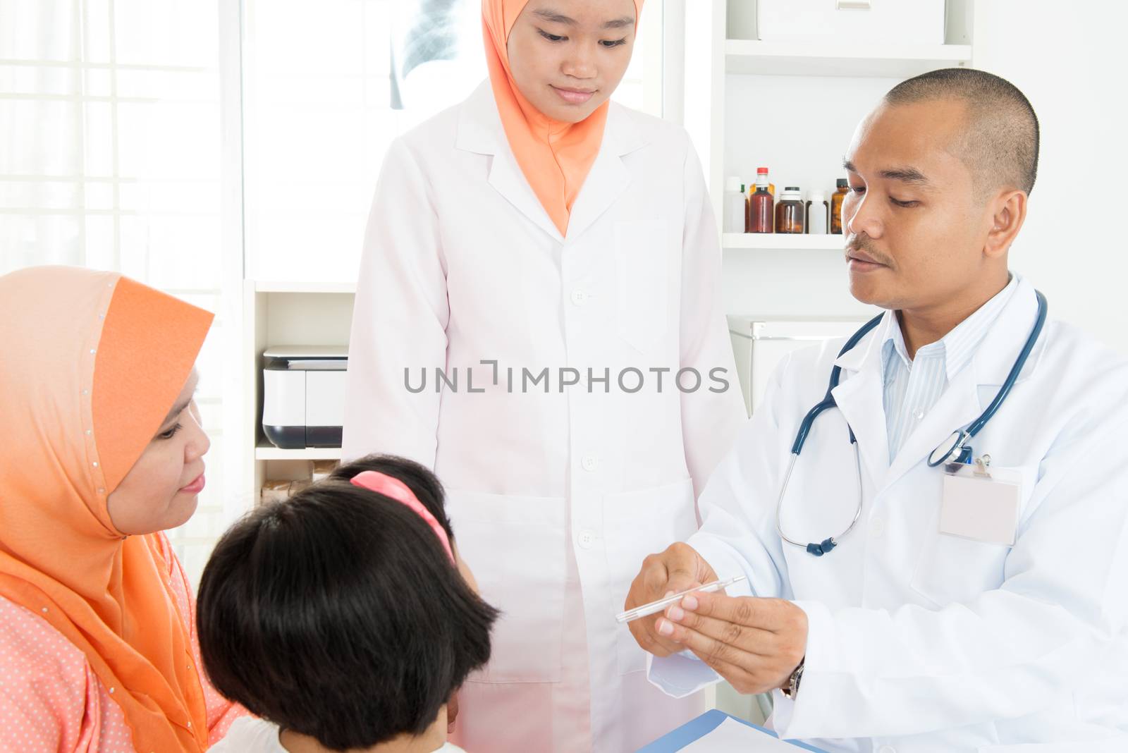 Doctor checking temperature of sick patient by szefei