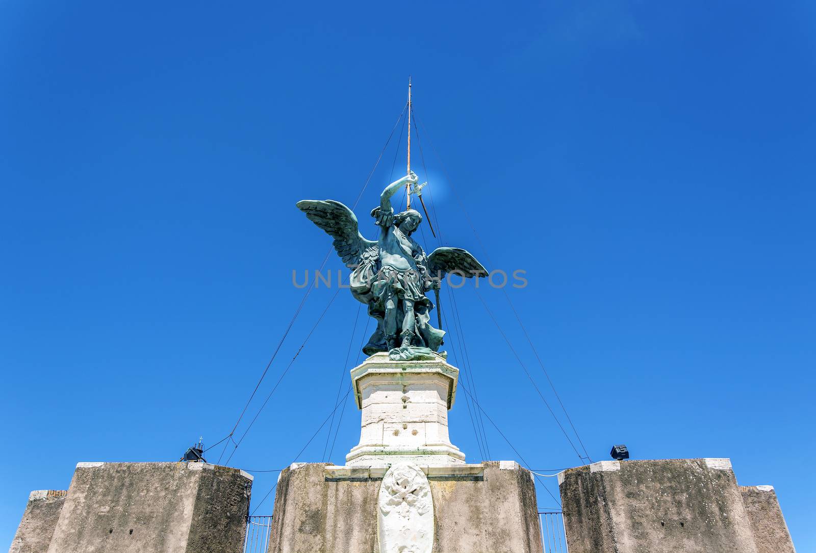 Bronze Statue of the archangel Michael on top of Castel Sant Angelo (castle of the holy angel)  in Rome, Italy