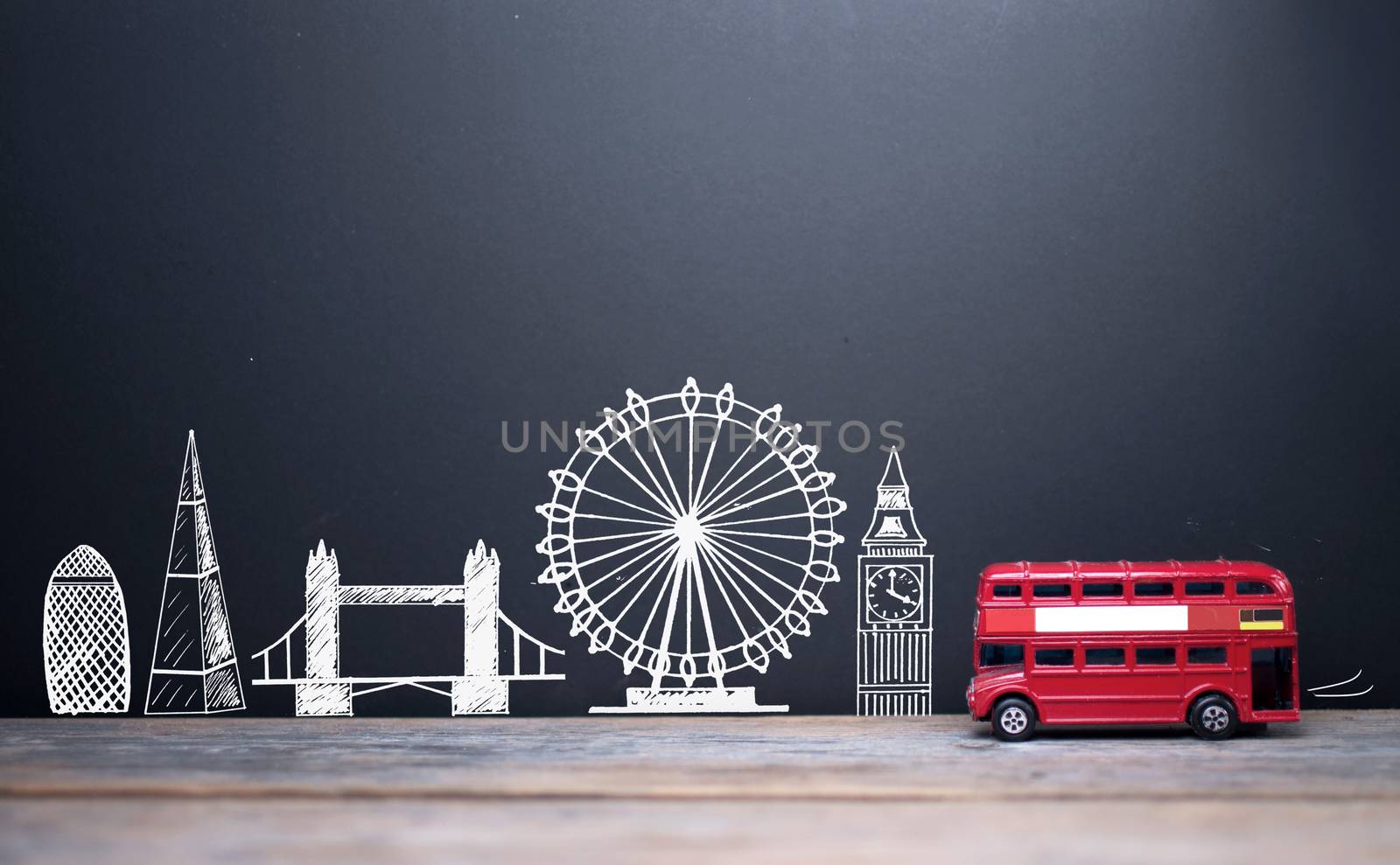 London landmarks drawn on a blackboard with a double decker bus 