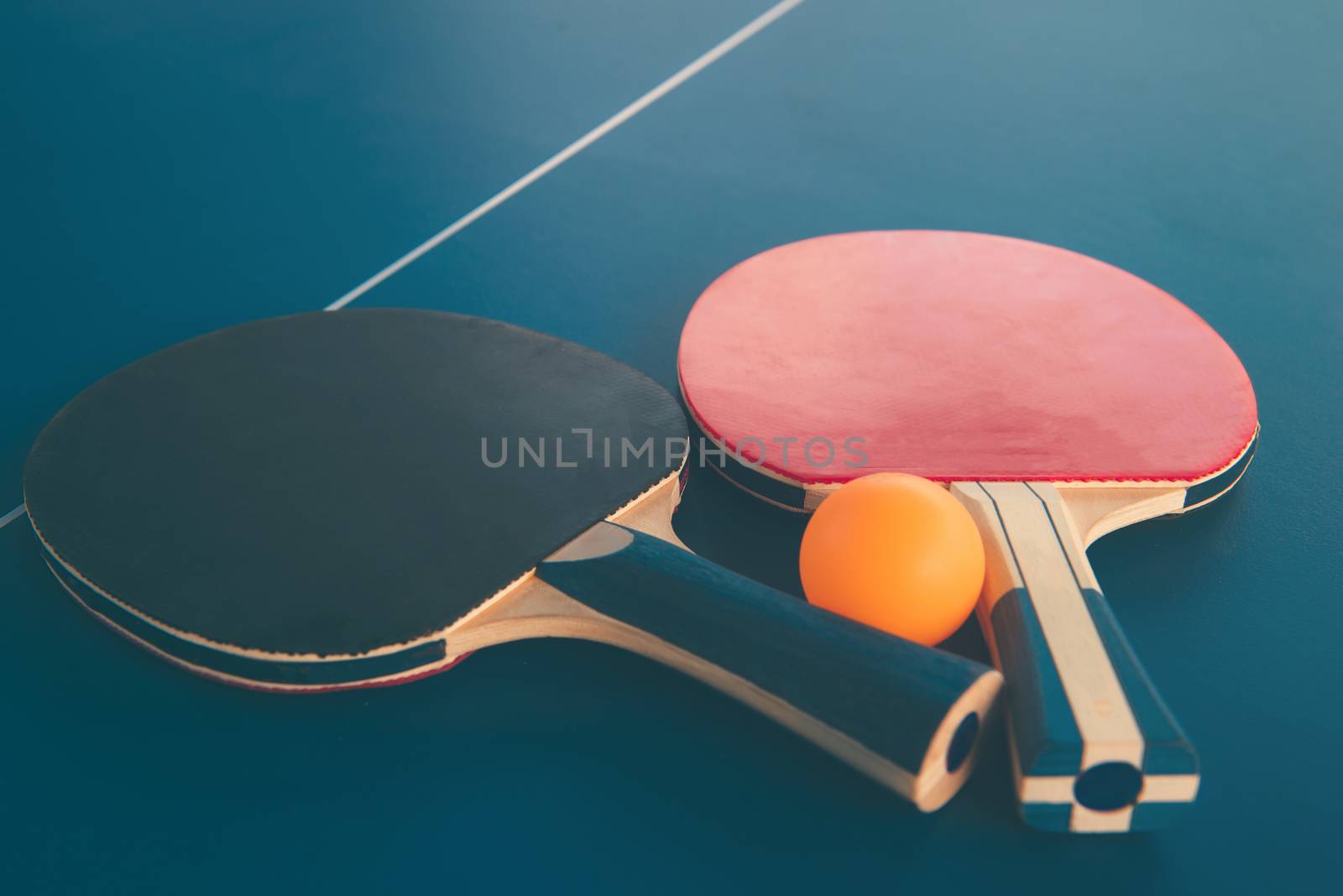 Tabletennis or ping pong rackets and balls on table. Sport concept.
