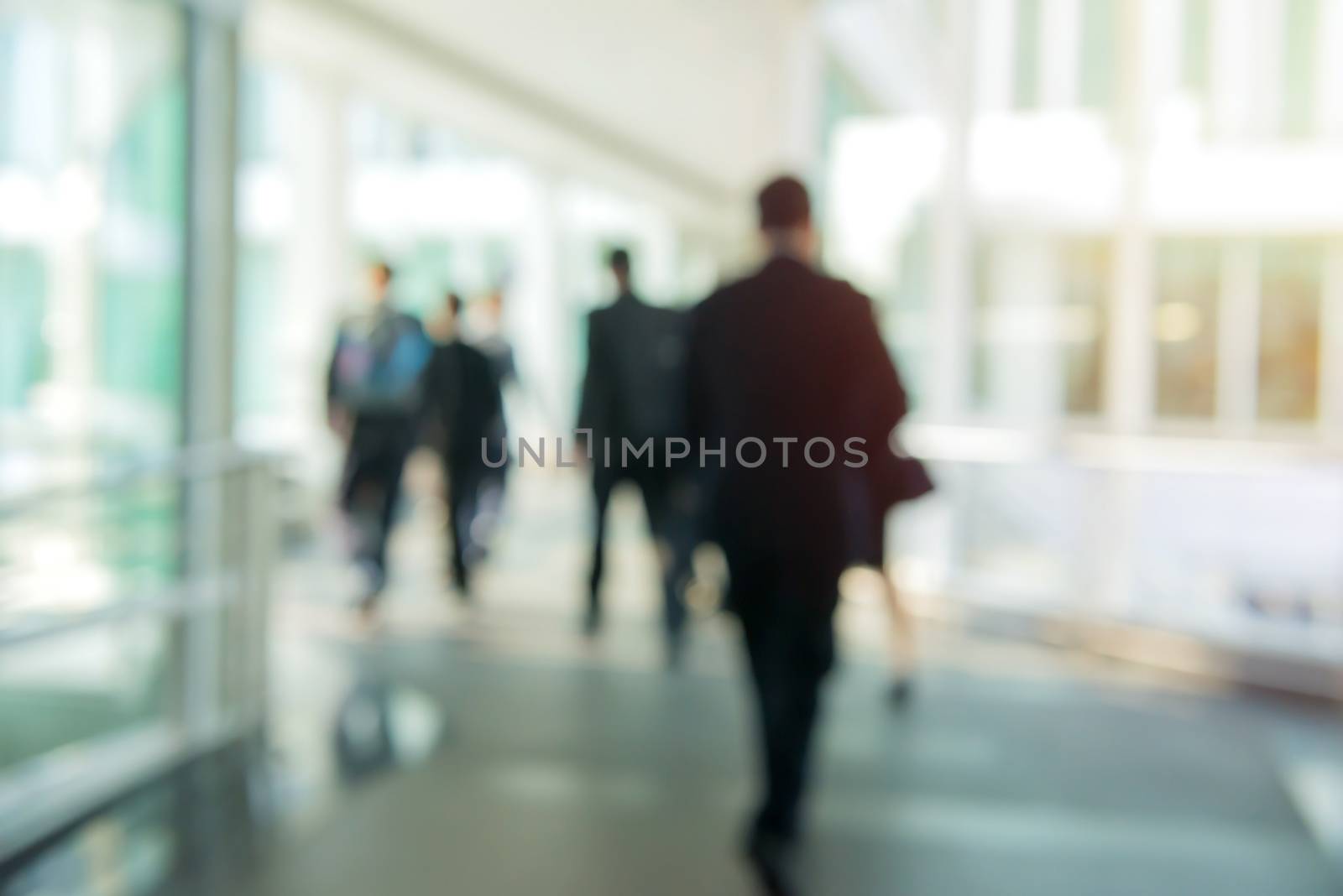 blur People Walking in the corridor of business center by casanowe