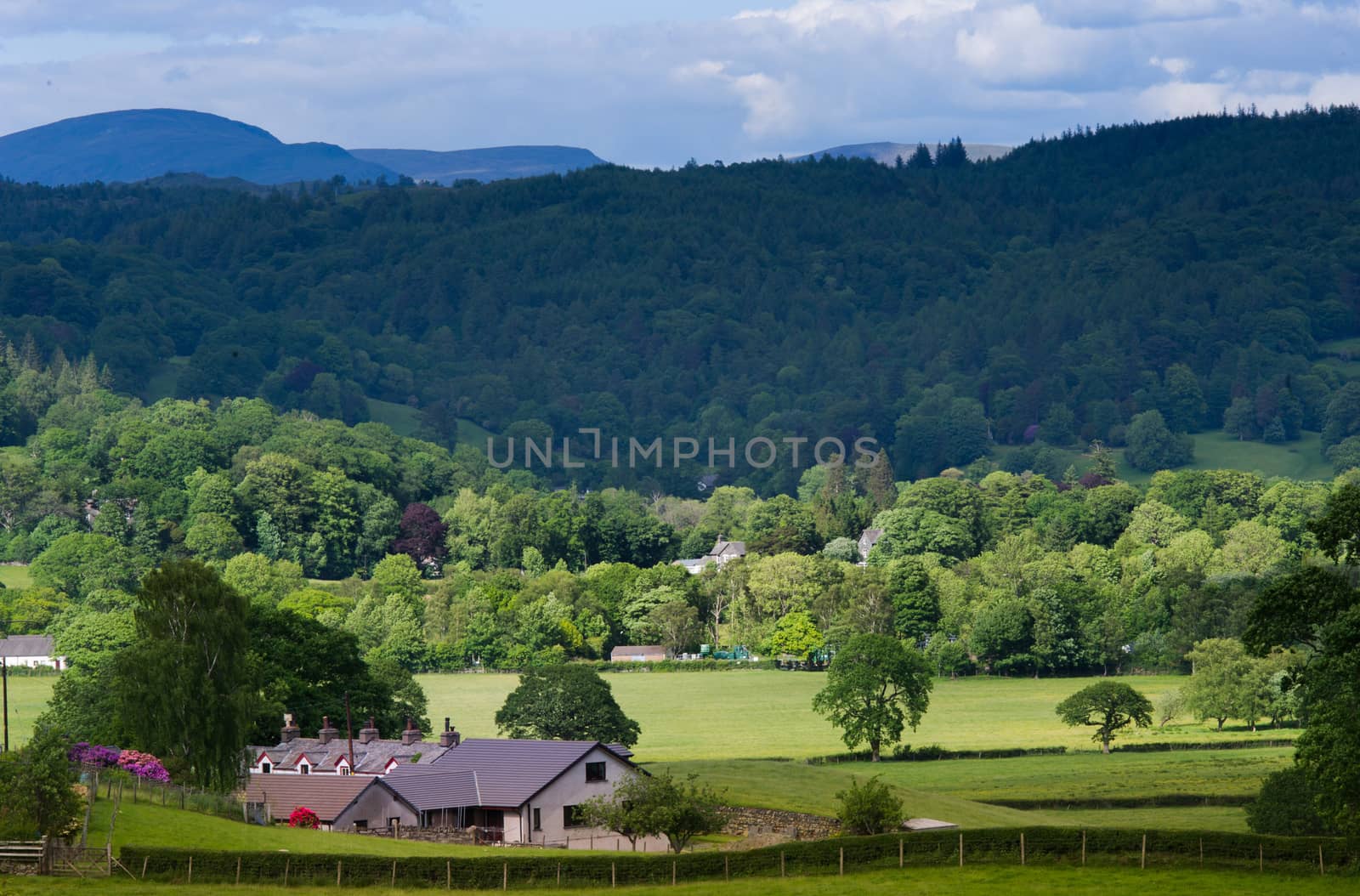 Scenic view of mountainous landscape of Lake District National park with Blea Tarn house in foreground, Cumbria, England