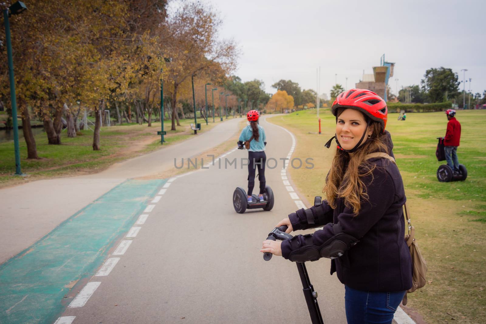 Group of people traveling on Segway in the park.
