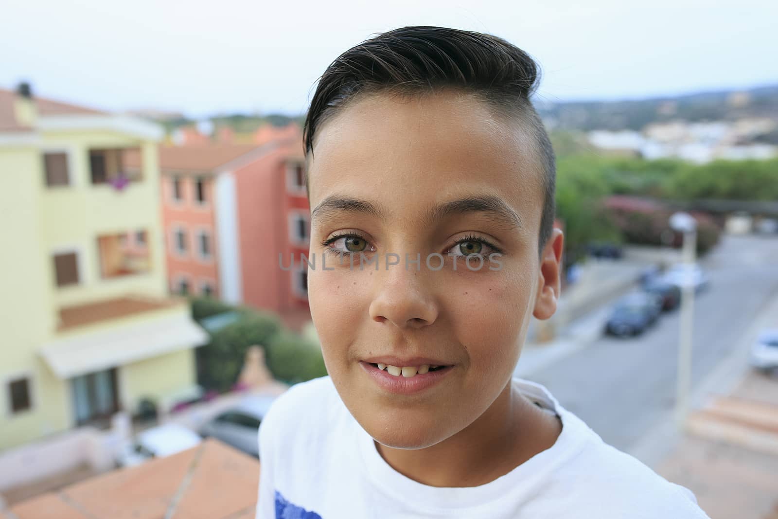 Boy with beautiful green eyes smiling