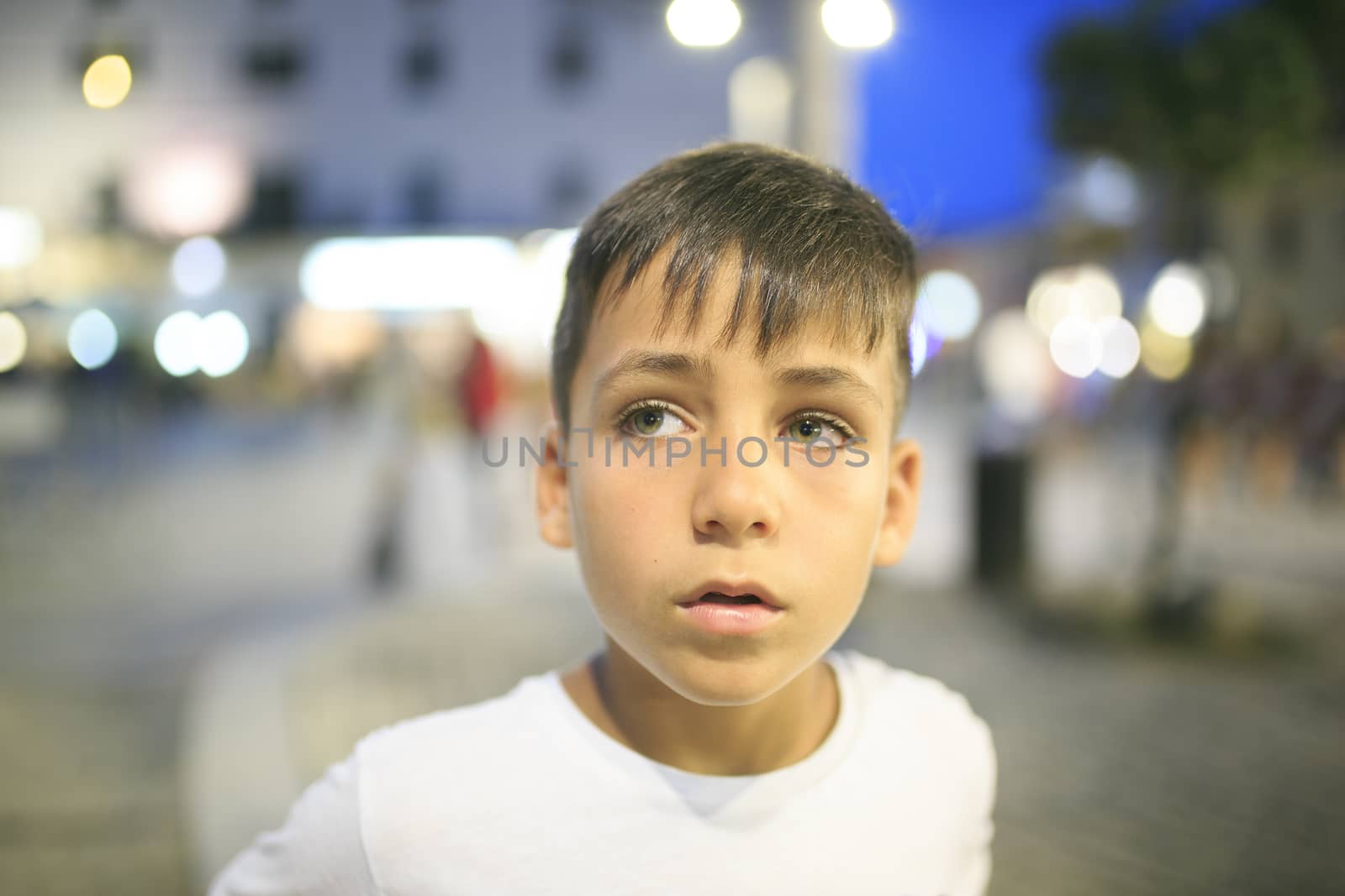 Boy with beautiful green eyes looking at the camera