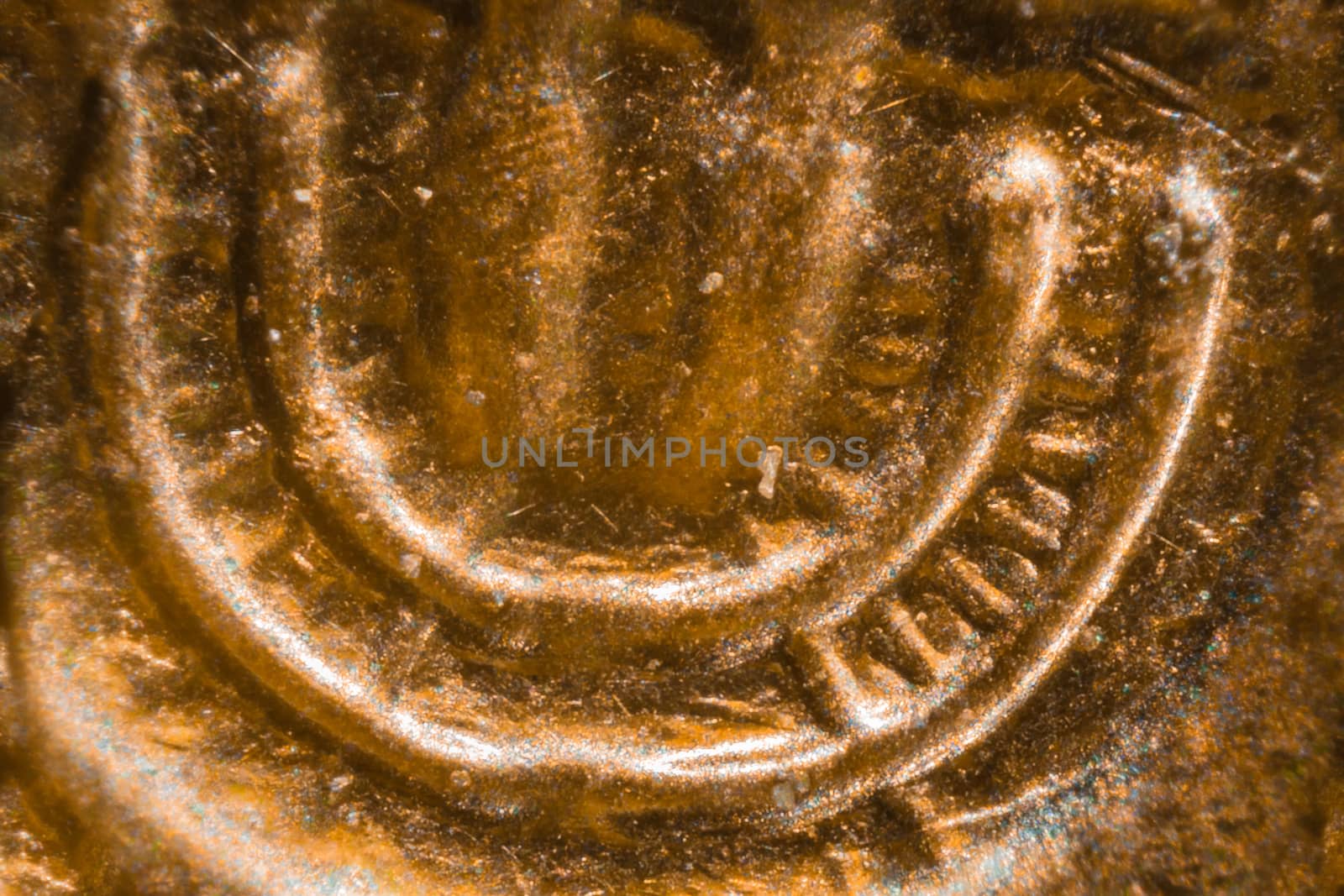 Israeli 10 Agorot coin under the microscope. Closeup macro photography.
