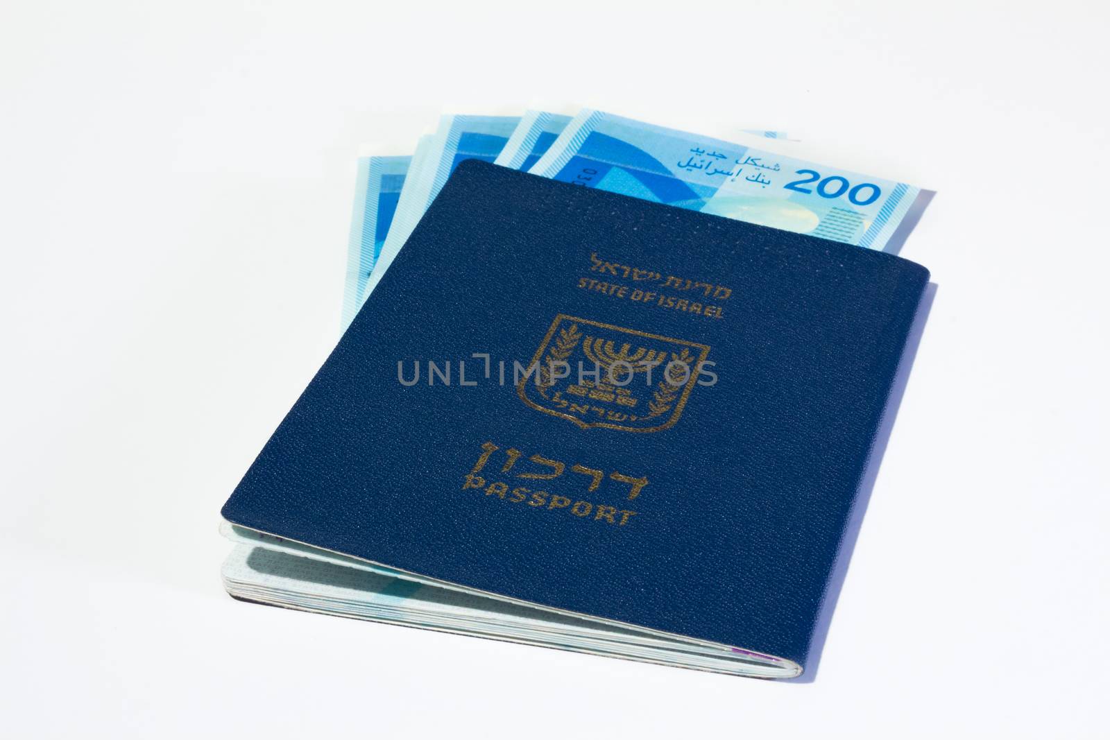 Stack of israeli money bills of 200 shekel and israeli passport.