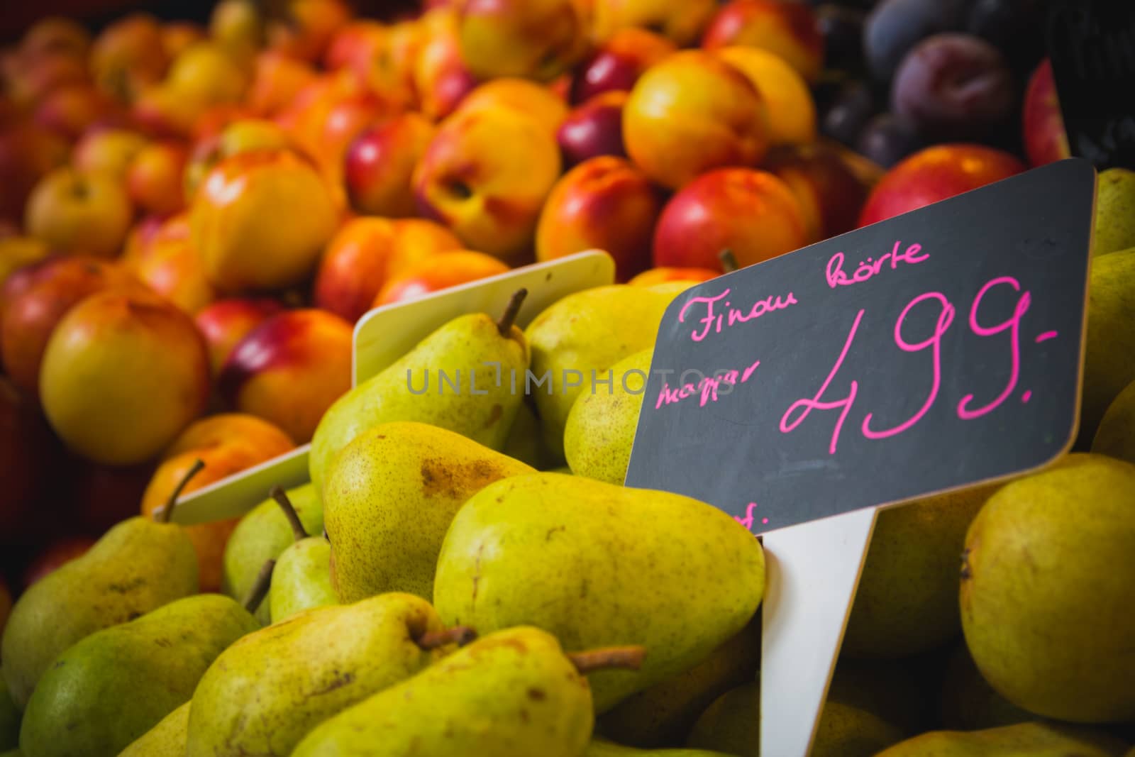 Pears and Peaches at a grocery marketplace stall.