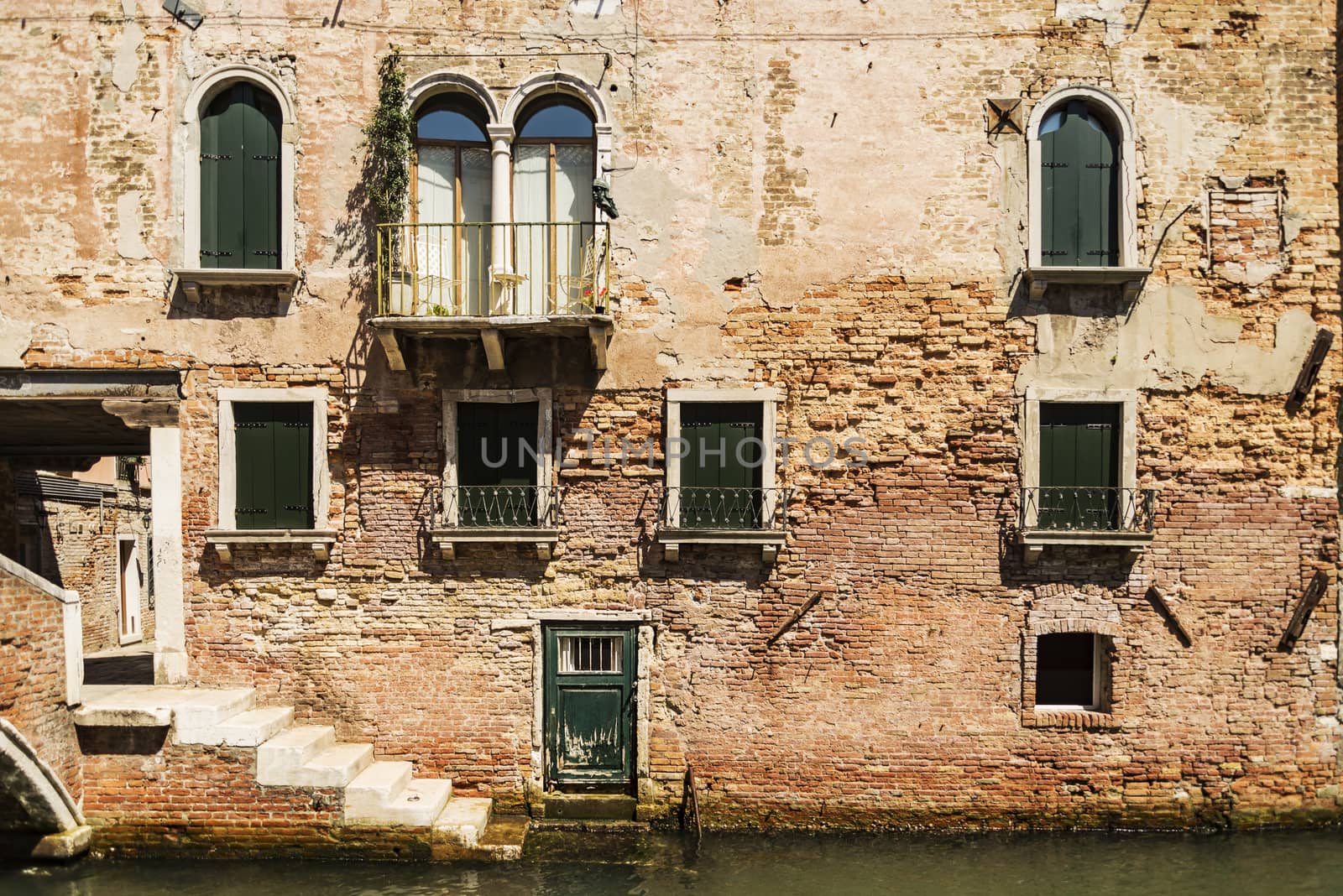 Old building along canals in Venice, Italy