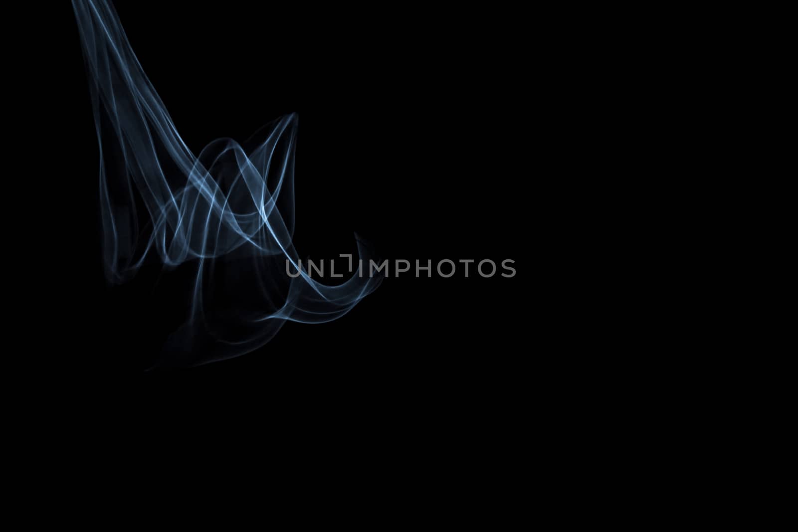 Light painted glowing abstract light blue and white curved lines on a black background