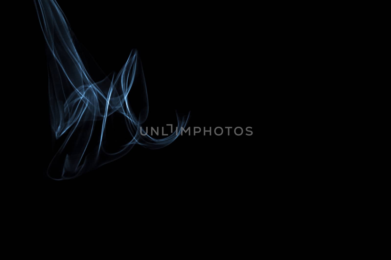 Light painted glowing abstract light blue and white curved lines on a black background