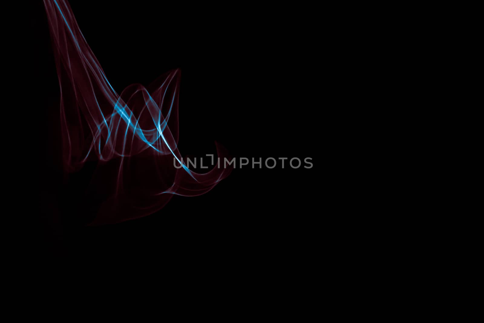 Light painted glowing abstract blue and red curved lines on a black background