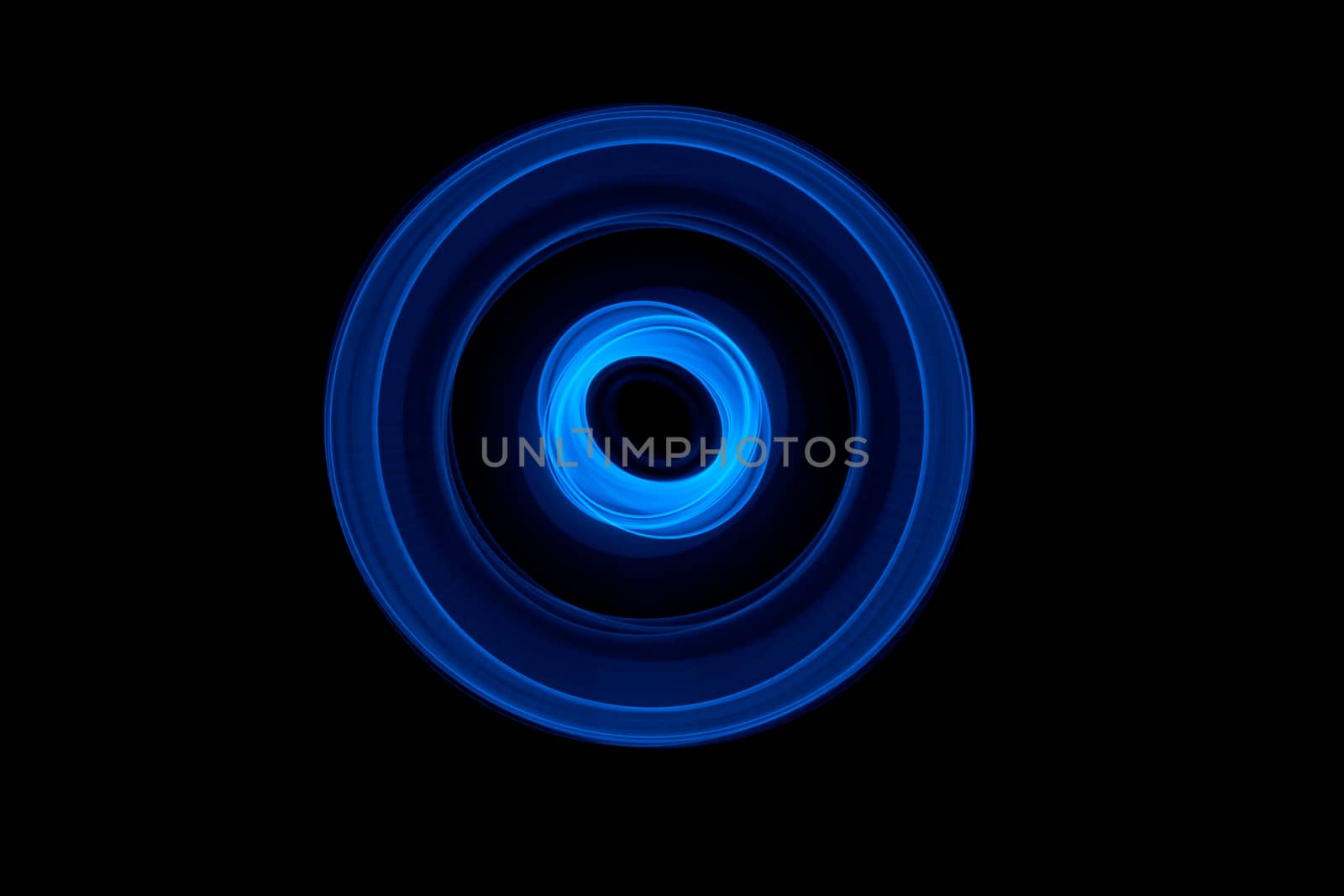 Light painted glowing abstract blue curved lines on a black background