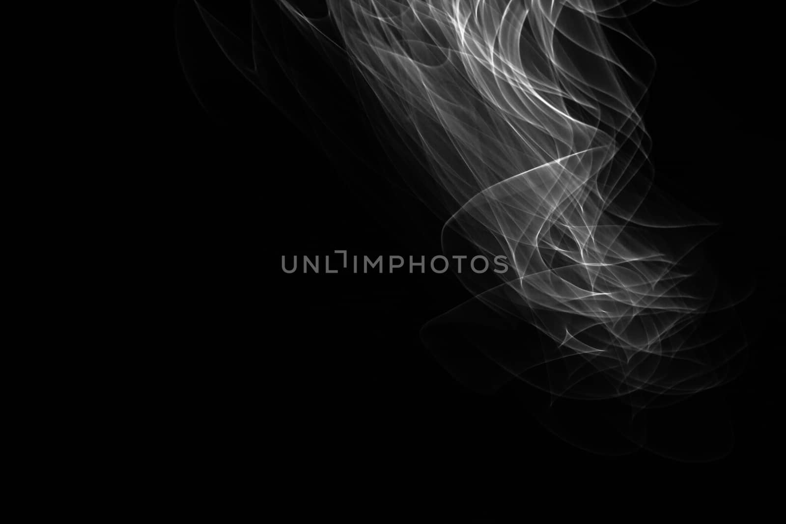 Light painted glowing abstract black and white curved lines on a black background