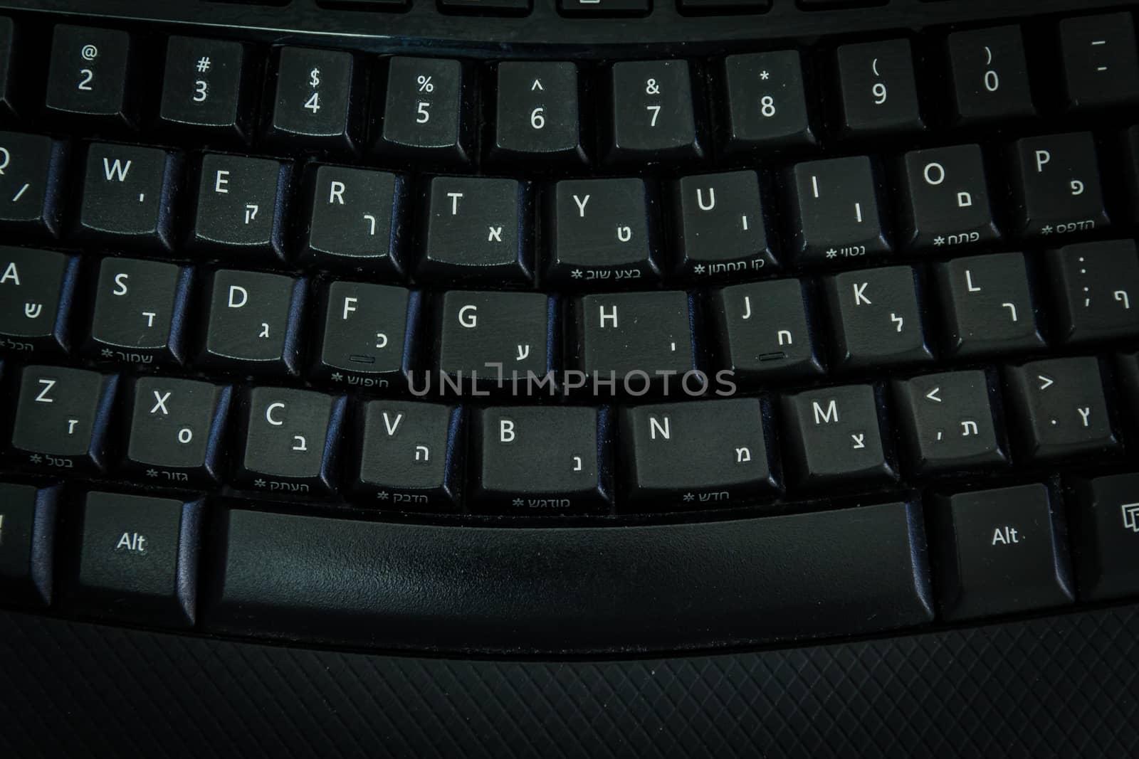 Keyboard with letters in Hebrew and English - Wireless keyboard - Top View -  Dark atmosphere