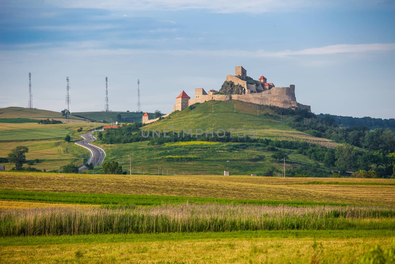 Rupea, Romania - June 23, 2013: Old medieval fortress on top of the hill, Rupea village located in Transylvania, Romania