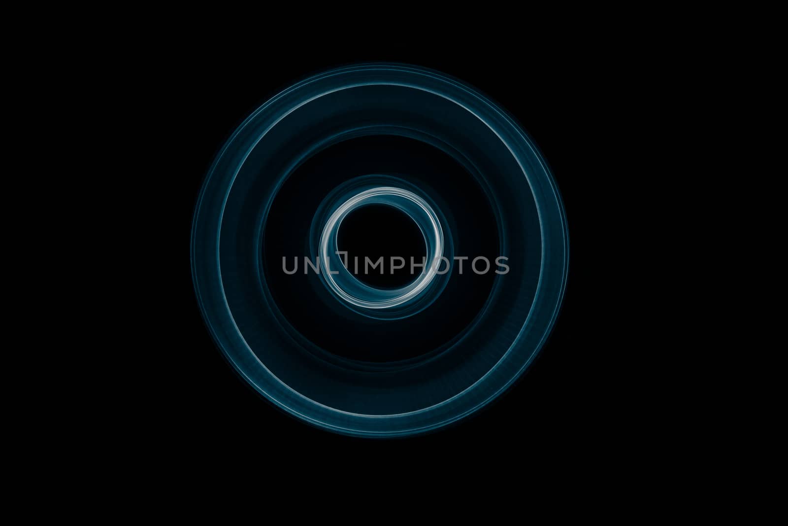 Light painted glowing abstract blue and white curved lines on a black background